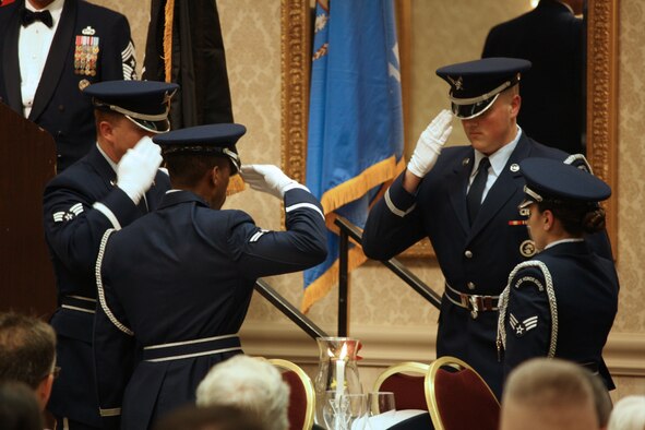 Airmen from the Vance Silver Talon Honor Guard render a salute during a prisoner-of-war and missing-in-action table ceremony at the Oklahoma Military Hall of Fame 2014 class induction at the Oklahoma Tower Hotel in Oklahoma City Nov. 8. (Courtesy photo)