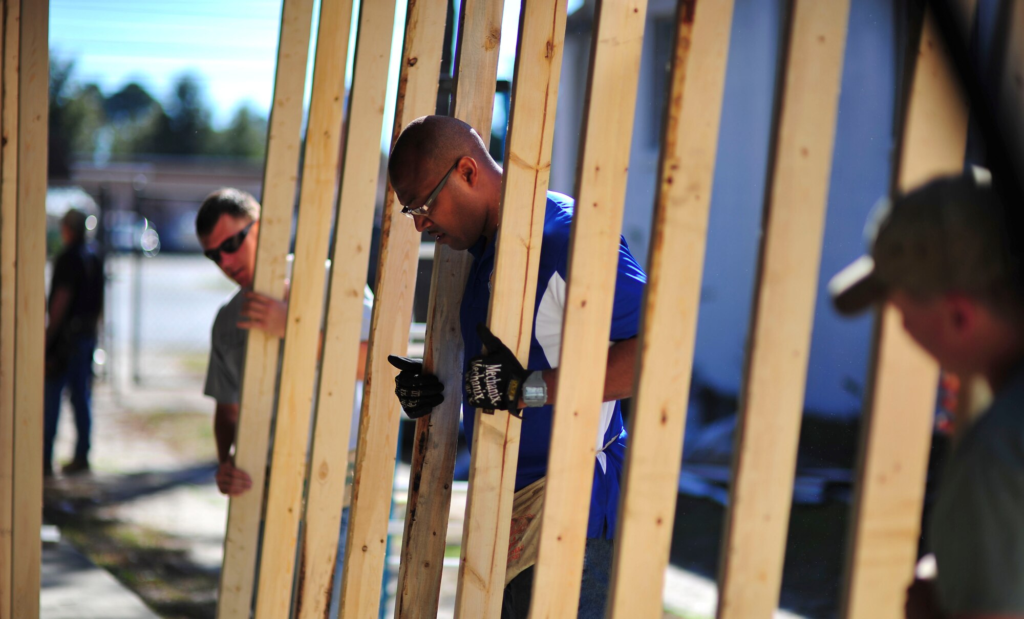 Master Sgt. Edward Williams, 325th Contracting Squadron tenant support flight superintendent, prepares to lift a wall while volunteering at the Habitat for Humanity on Nov. 10. He was one of many members of Team Tyndall to volunteer throughout the community during a Comprehensive Airman Fitness day. (U.S. Air Force photo by Airman 1st Class Dustin Mullen)