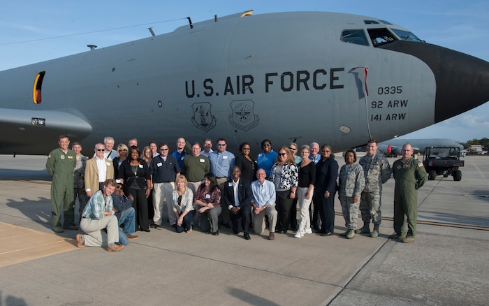 Members of Joint Base Charleston leadership (left) Col. John Lamontagne, 437th Airlift Wing commander, Chief Master Sgt. Shawn Hughes, 437th AW command chief;(right) Chief Master Sgt. Gigi Manning, 315th Airlift Wing command chief, Chief Master Sgt. Mark Bronson, 628th Air Base Wing command chief and Col. Scott Sauter, 315th AW commander, stand with members of the JB Charleston Civic Leader Program in front of a KC-135, Nov. 4, 2014, at MacDill Air Force Base, Fla. The civic leaders participated in a military tour highlighting the 6th Air Mobility Wing mission. (U.S. Air Force photo / Senior Airman Tom Brading)