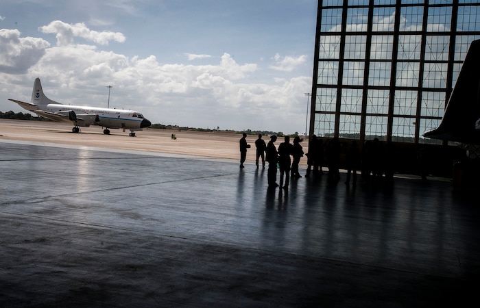 Members of the Joint Base Charleston Civic Leader Program visit Hangar 5, Nov. 4, 2014, at MacDill Air Force Base, Fla., where the National Oceanic and Atmospheric Administration (NOAA) operates. The NOAA mission includes the “Hurricane Hunters” teams of pilots and scientists who fly into hurricanes for scientific purposes. (U.S. Air Force photo/Senior Airman Tom Brading)