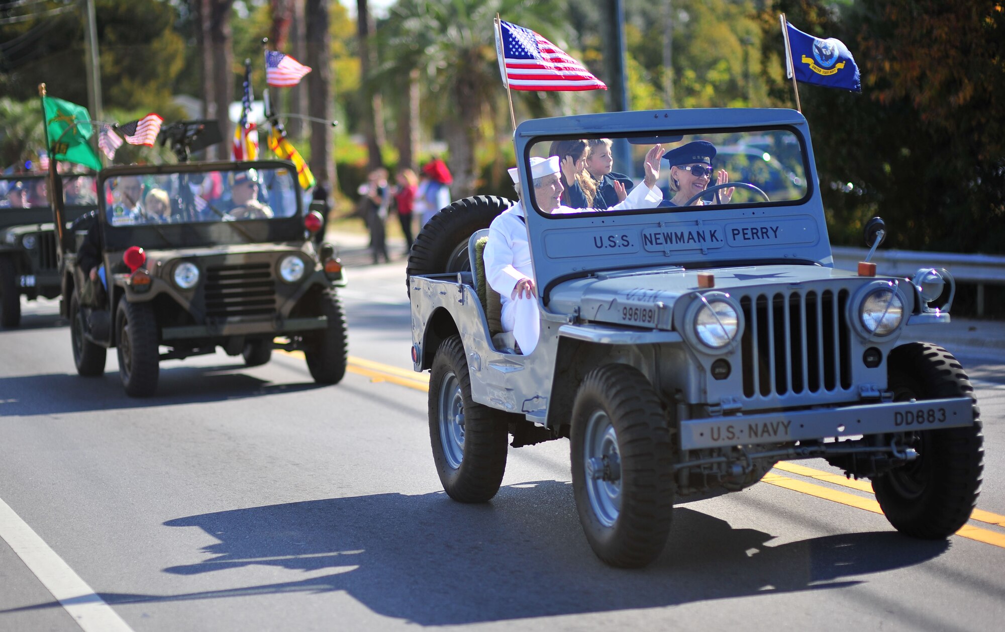 A WWII veteran gets escorted in the Veterans Day parade in Panama City on Nov 11. This parade is held every year to honor not just the sacrifices, but the heroism of the men and women in military uniforms. (U.S. Air Force photo by Airman 1st Class Dustin Mullen)