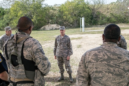 Col. Michael Gimbrone, 502nd Security Forces and Logistics Support Group commander, addresses members of the 902nd Security Forces Squadron after completing a barricaded suspect exercise Nov. 10 at Joint Base San Antonio-Randolph’s Camp Talon. Security forces members exchanged simulated munitions fire with hostiles throughout the exercise, bringing more realism while practicing assault force maneuvers during the exercise scenario. (U.S. Air Force photo by Johnny Saldivar)