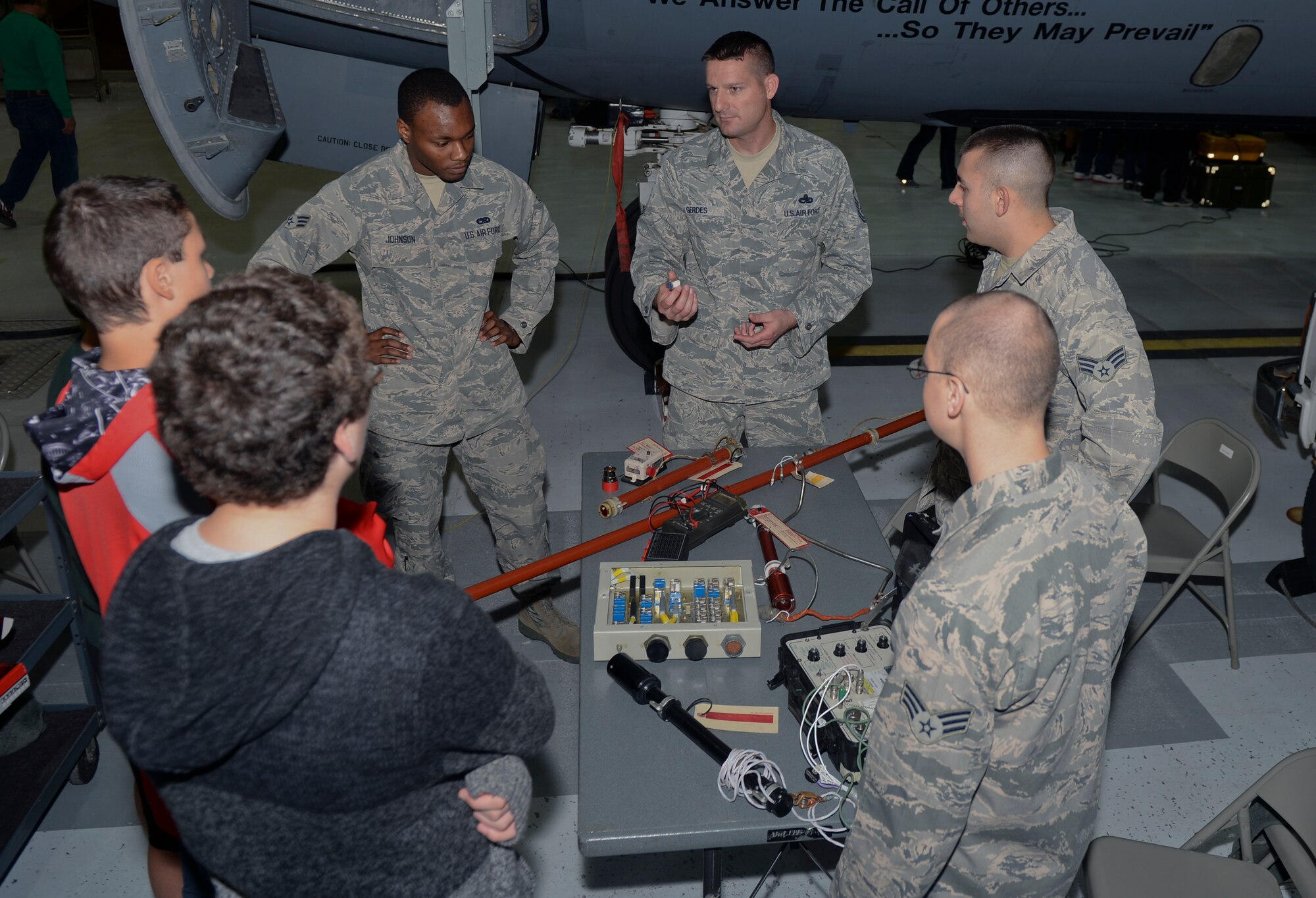 Master Sgt. Nicholas Gerdes, 373rd Training Squadron instrument flight control instructor, shows local high school student parts of a KC-135R Stratotanker, Nov. 7, at McConnell Air Force Base, Kan. Gerdes explained each part and the functionality of it to the students. (U.S. Air Force photo/Airman 1st Class Colby L. Hardin) 