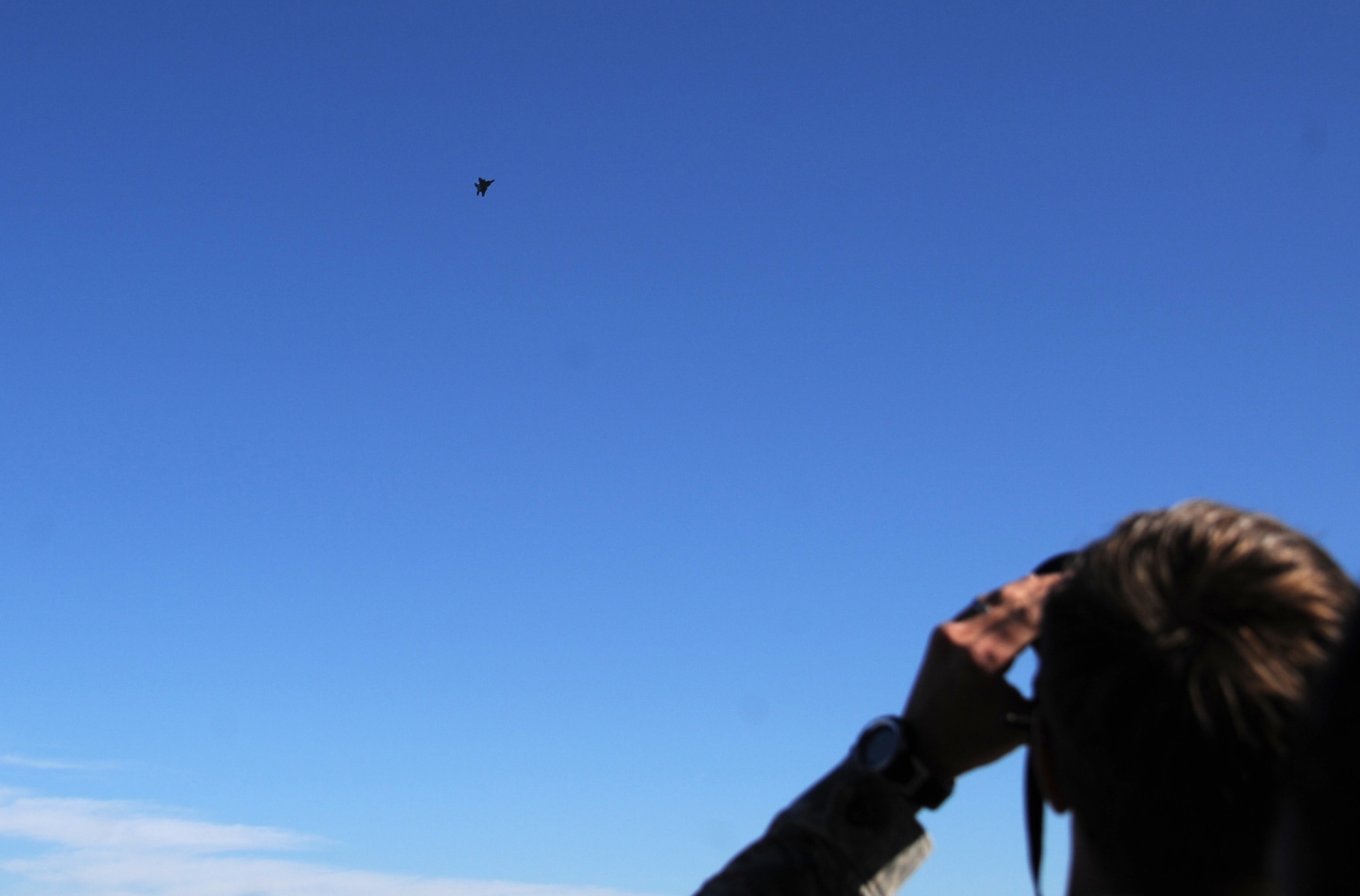 Senior Airman Gregory Bowers, 4th Medical Support Squadron health services administration technician, captures an F-15E Strike Eagle’s approach to base from the 4th Operations Support Squadron air traffic control tower during the first 4th Fighter Wing Mission Immersion Day at Seymour Johnson Air Force Base, North Carolina, Nov. 7, 2014. Mission Immersion Day will soon become a monthly event hosted by each fighter squadron in turn. The day was designed to give Airmen fulfilling support roles across the base a better understanding of how flying operations are conducted and how their efforts make it possible. (U.S. Air Force photo/Senior Airman Ashley J. Thum)