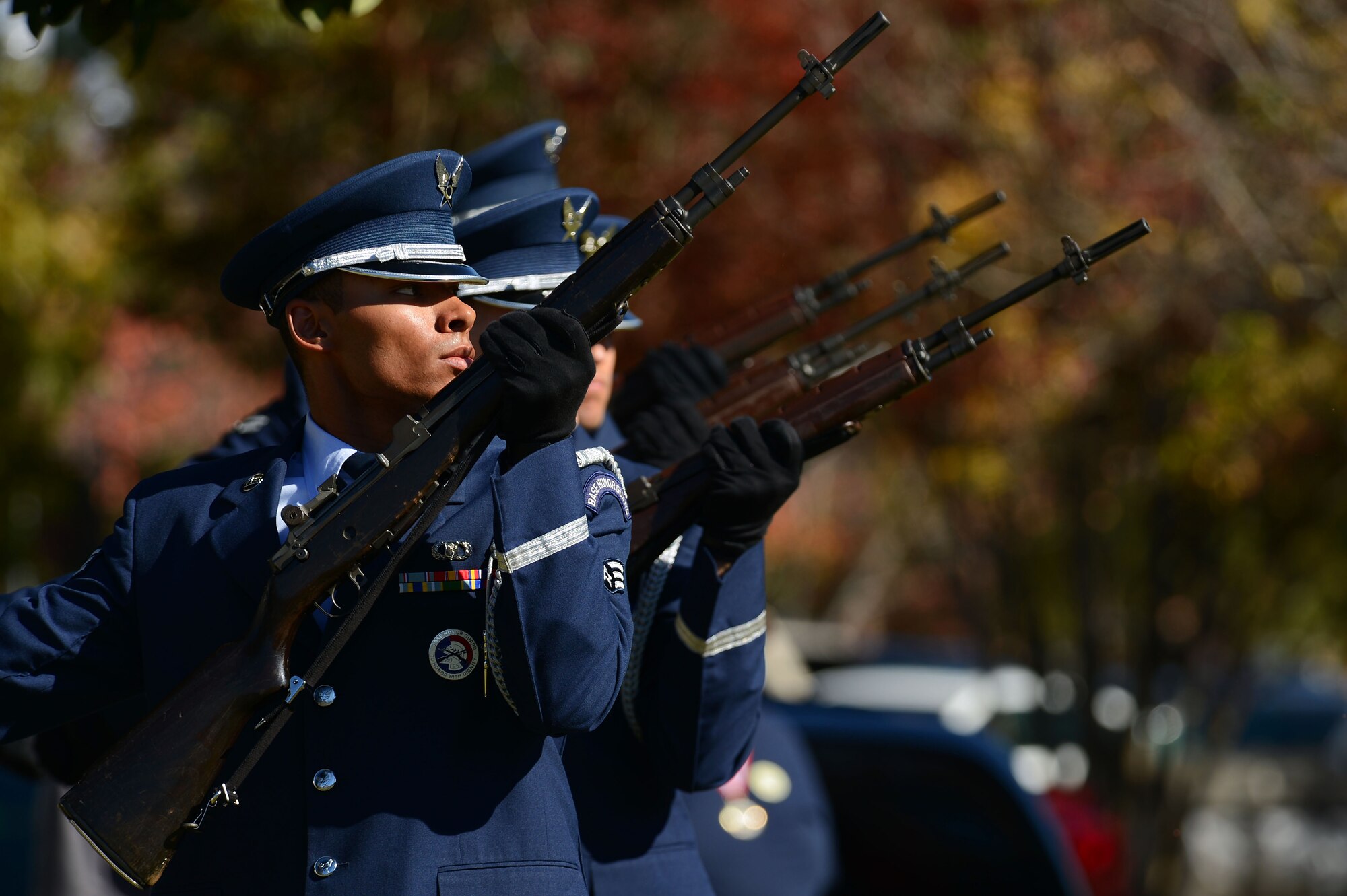 Airmen assigned to the 20th Force Support Squadron base honor guard, perform a 3-volley rifle salute during a Veterans Day ceremony at the Sumter County Courthouse, Sumter, S.C., Nov. 11, 2014. A 3-volley salute is a ceremonial act performed by military members by firing blank cartridges into the air three times. (U.S. Air Force photo by Airman 1st Class Jensen Stidham/Released) 