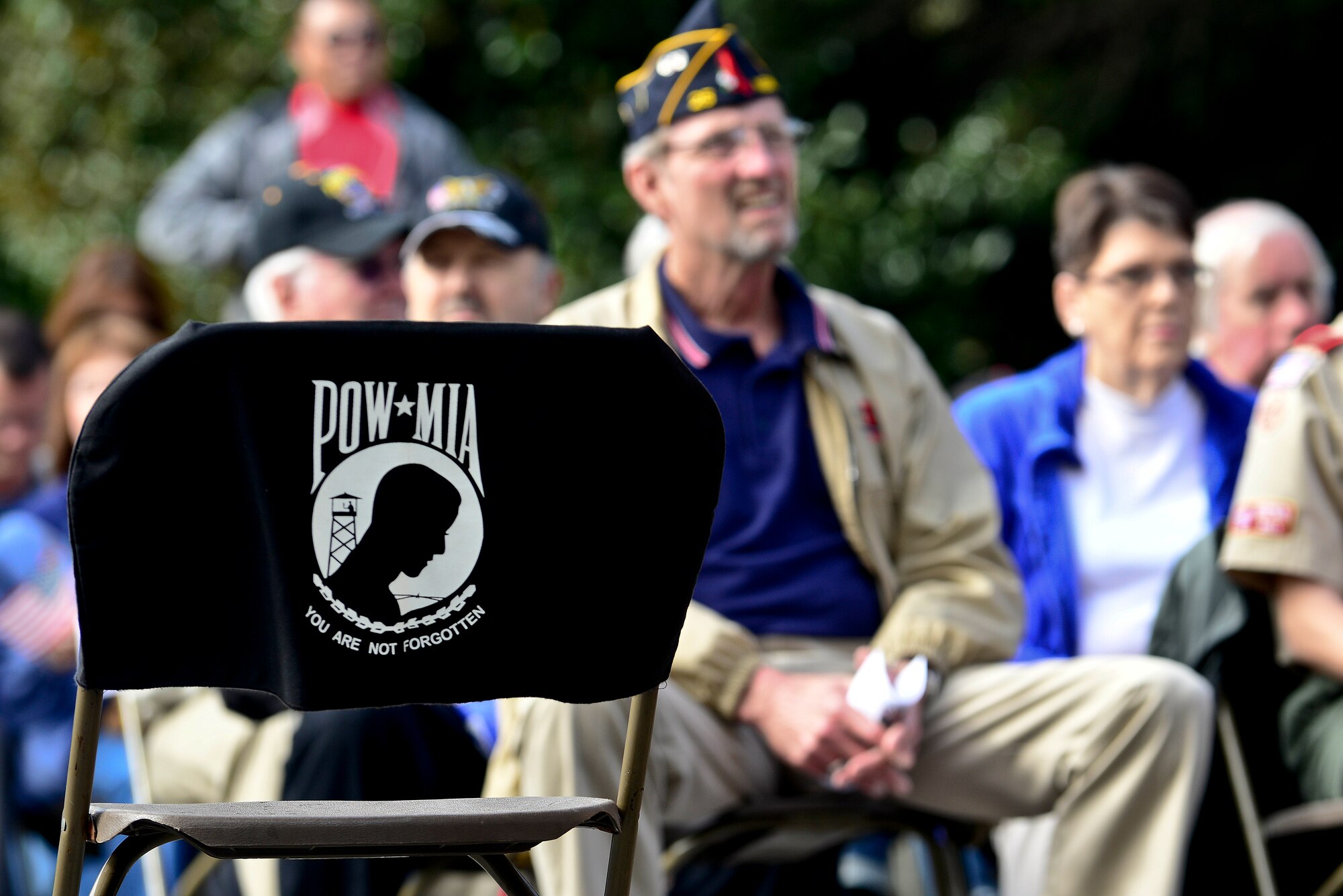 A chair sits empty as the prisoner of war and missing in action representation during a Veteran’s Day ceremony at the Victory Arch in Newport News, Va., Nov. 11, 2014. The ceremony was hosted by the Braxton-Perkins Post 25, The American Legion. (U.S. Air Force photo by Senior Airman Kimberly Nagle/Released)