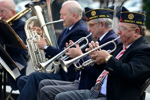 The Braxton-Perkins Post 25 Brass Ensemble performs during a Veteran’s Day ceremony at the Victory Arch in Newport News, Va., Nov. 11, 2014. The ensemble played throughout the ceremony including an armed forces tribute. (U.S. Air Force photo by Senior Airman Kimberly Nagle/Released)