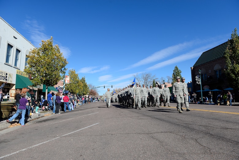 Team Schriever members march in the Colorado Springs Veterans Day Parade Nov. 8, 2014, in Colorado Springs, Colo. Thousands of community members lined Tejon Street to show their support. (U.S. Air Force Photo/Christopher DeWitt)     