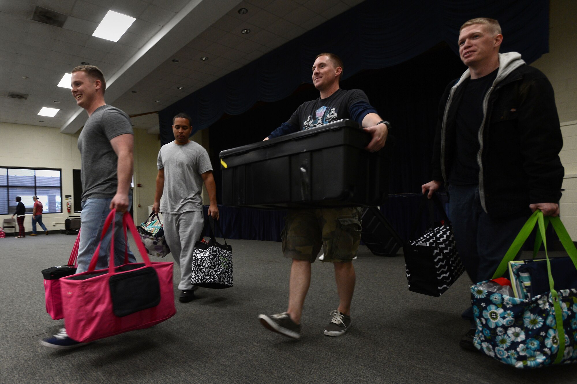 U.S. Air Force Airmen attending the Senior Master Sgt. David B. Reid Airman Leadership School, Class 14-8, help clean at the Winter Wonderland Bazaar at Shaw Air Force Base, S.C., Nov. 8, 2014. During the five-week course, ALS students participate in at least one volunteer project to benefit the community on and off base. (U.S. Air Force photo by Airman 1st Class Jensen Stidham/Released)