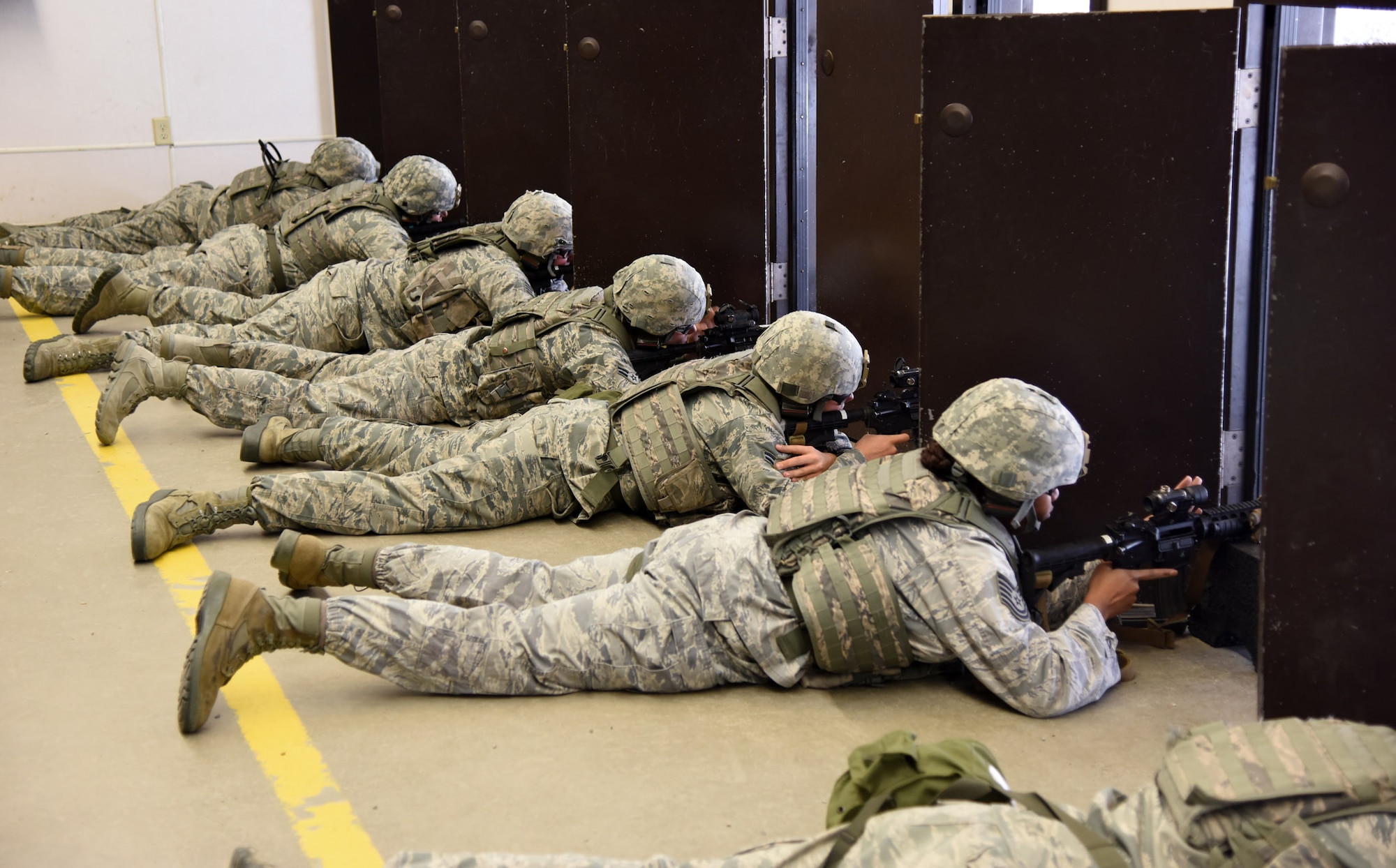 Security forces members from Malmstrom Air Force Base prepare to fire M4 carbines during their annual qualification training at the Combat Arms Training and Maintenance shooting range Oct. 30. The knowledge gained from a CATM course covers a wide variety or scenarios, techniques and weapons systems. (U.S. Air Force photo/ Airman 1st Class Joshua Smoot)
