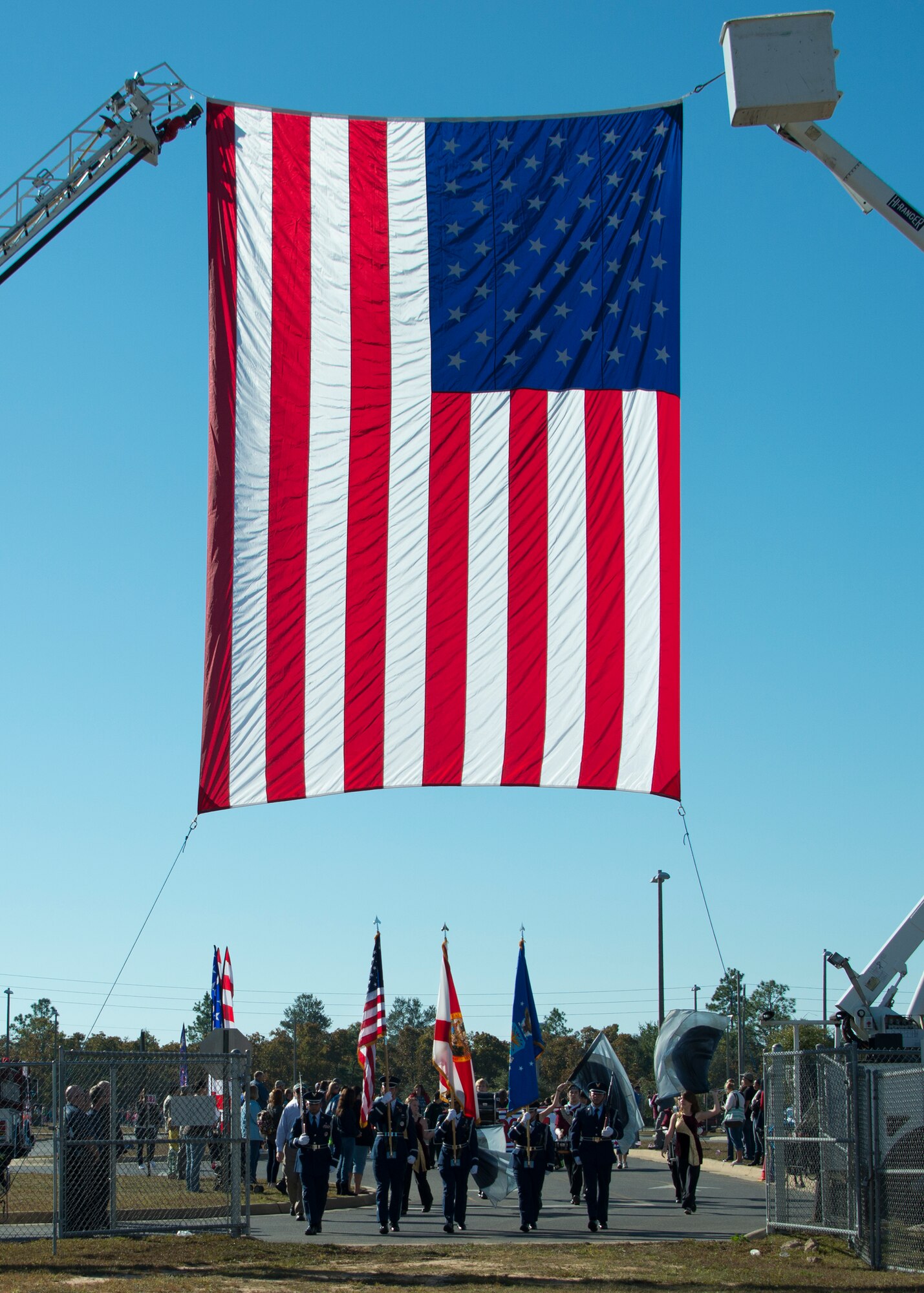 The Eglin Air Force Base honor guard brings in the colors during a Veteran’s Day parade held at Riverside Elementary in Crestview, Fla., Nov. 10.  Airmen from explosive ordnance disposal, life support, honor guard and 6th Ranger Training Battalion Soldiers were on hand to interact with the children in this first-ever school event.  (U.S. Air Force photo/Tech. Sgt. Jasmin Taylor)