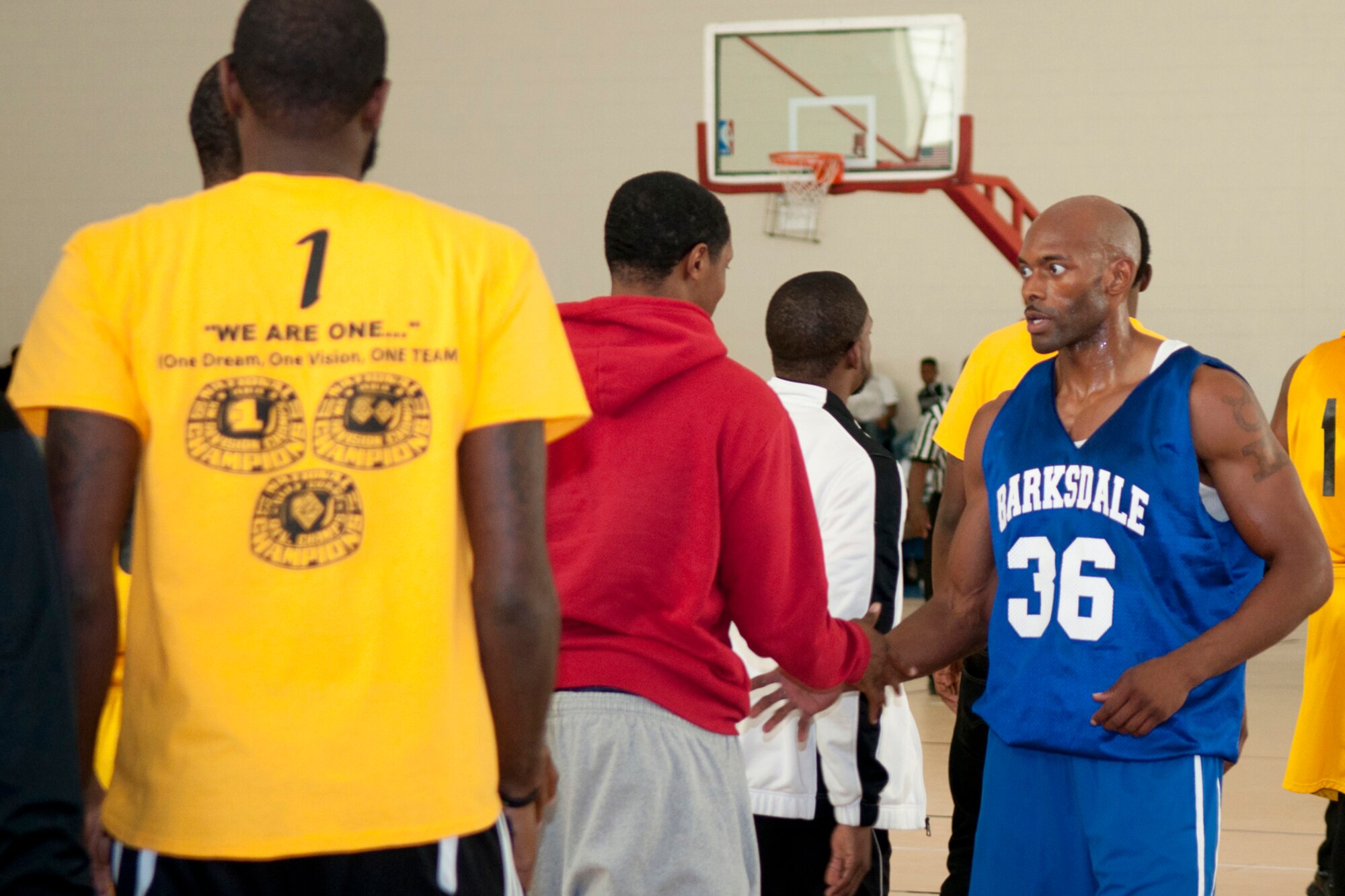 Robert Harris Jr. of the Barksdale All-Stars Basketball Team shakes hands at the end of a game against the Shreveport-Bossier Mavericks at the Senior Airman Bryan R. Bell Fitness Center on Barksdale Air Force Base, La., Nov. 1, 2014. The Mavericks are part of the American Basketball Association and took the time to play an exhibition game with the Barksdale All-Stars before the beginning of their professional season. (U.S. Air Force photo by Master Sgt. Dachelle Melville/Released)