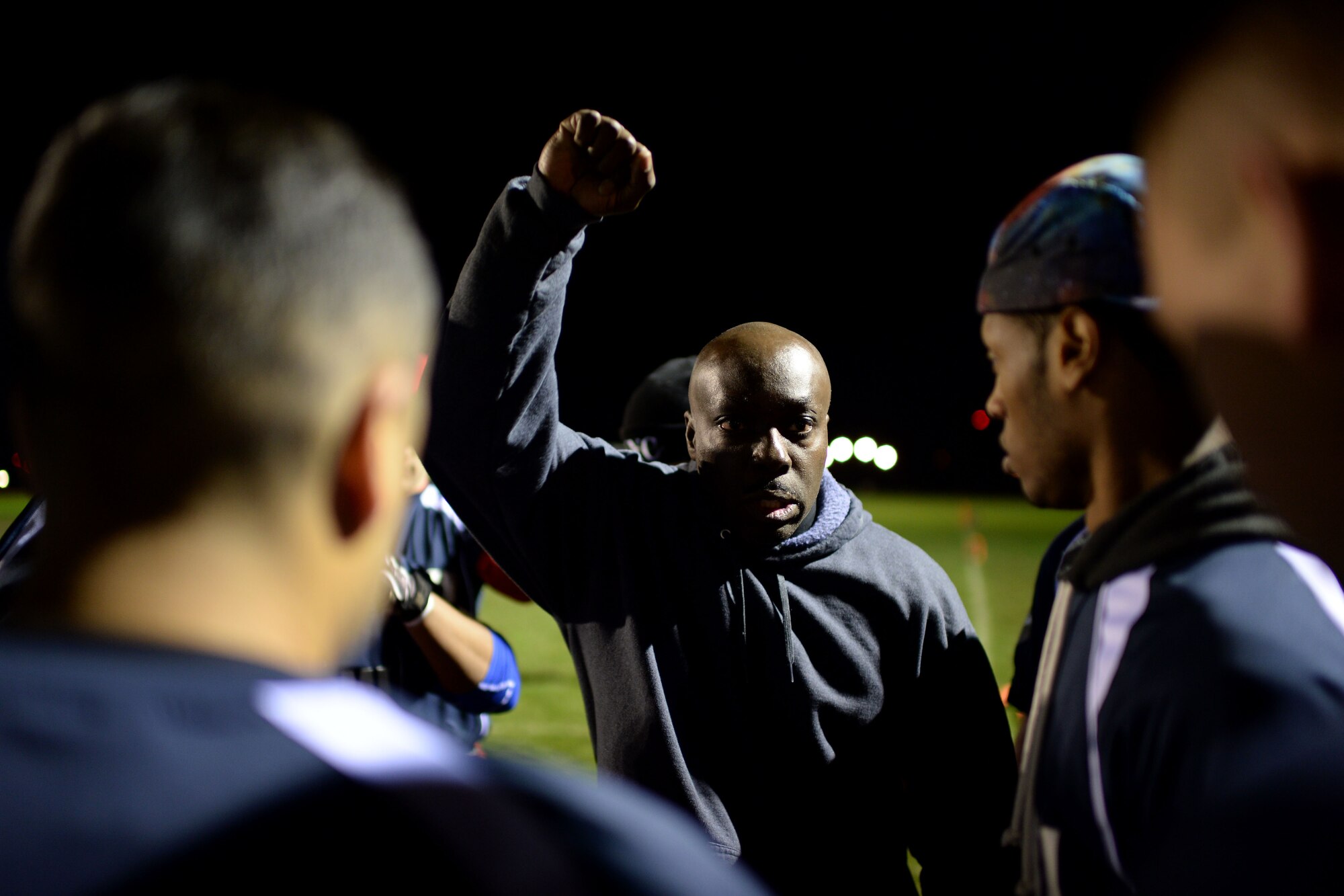 The 52nd Communications Squadron football team coach, motivates his team during the intramural football championship game at Spangdahlem Air Base, Germany, Nov. 10, 2014. The 52nd CS won 15 out of 19 games for the season. (U.S. Air Force photo by Staff Sgt. Daryl Knee/Released)