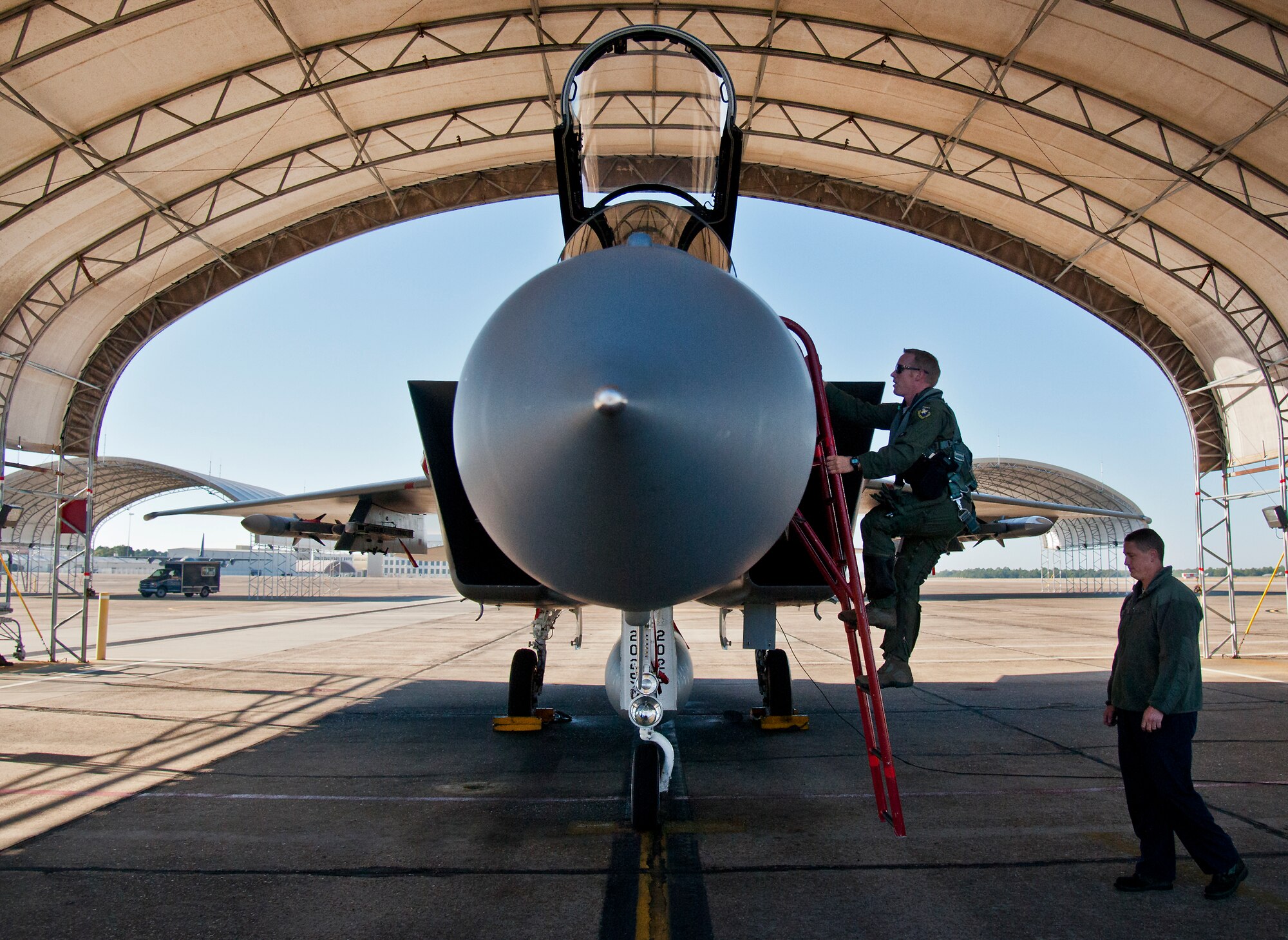 Maj. Christopher Wee, Operation Flight Program Combined Test Force, climbs into his F-15 Eagle prior to a morning sortie at Eglin Air Force Base, Fla.  The OFPCTF Airmen fly test missions exclusively in various F-15 models. The OFPTCF is partially owned by both the 53rd Wing and 96th Test Wing. (U.S. Air Force photo/Samuel King Jr.)
