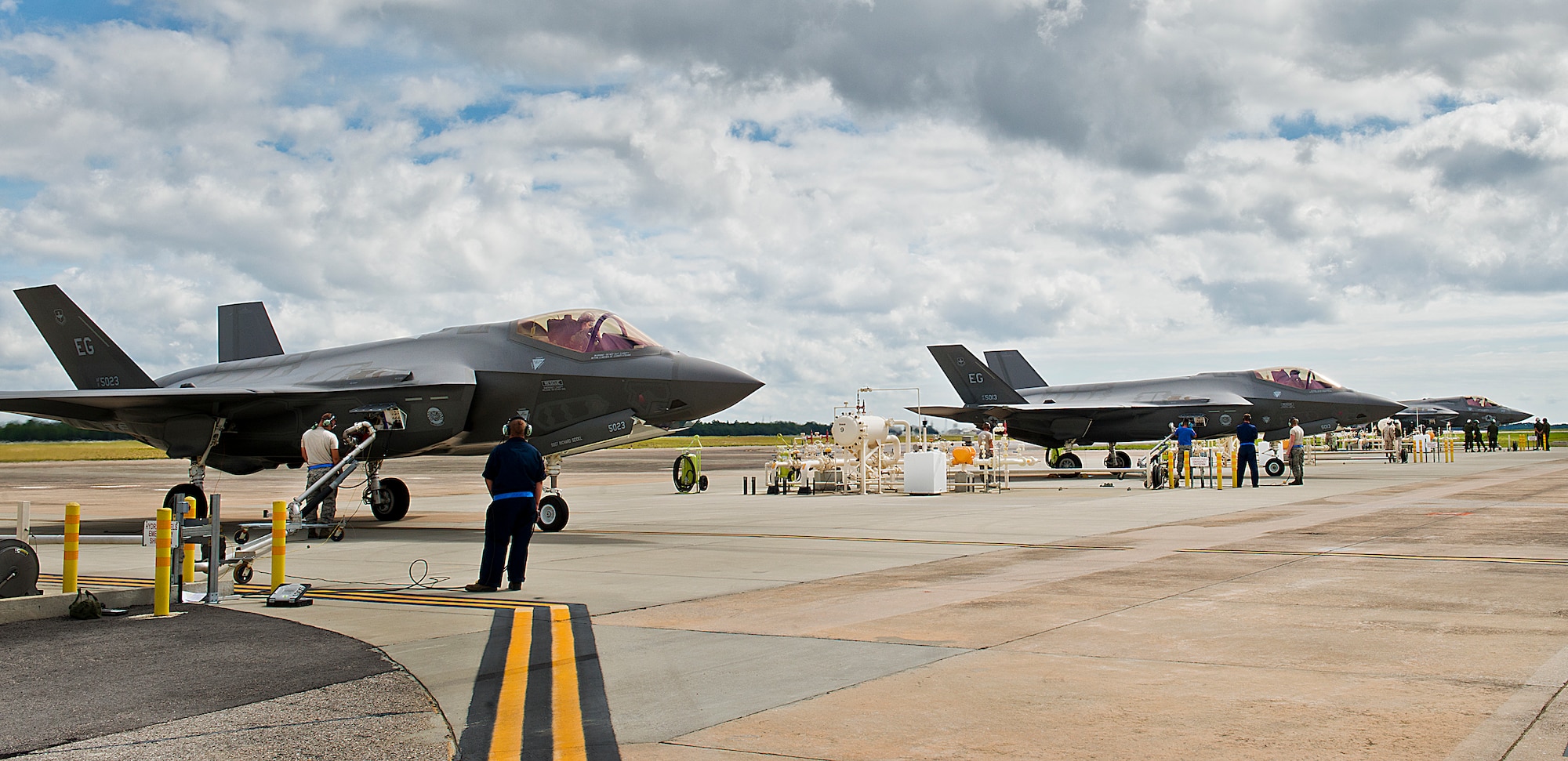 F-35 Lightning II variants receive fuel in the hot pit areas of the 33rd Fighter Wing flightline at Eglin Air Force Base, Fla.  All of the F-35 variants use the refueling areas in conjunction with the 96th Logistics Readiness Squadron’s fuels flight. (U.S. Air Force photo/Samuel King Jr.) 