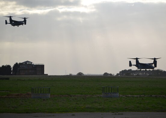 Two CV-22B Ospreys from the 7th Special Operations Squadron land at a designated area to infiltrate Air Commandos from the 321st Special Tactics Squadron, along with host nation partners, Nov. 5, 2014, during a training mission at RAF Sculthorpe in Norwich, England. During the mission, Air Commandos searched for simulated potential threats and rescued simulated hostages in the training area. (U.S. Air Force photo by Tech. Sgt. Stacia Zachary/Released)