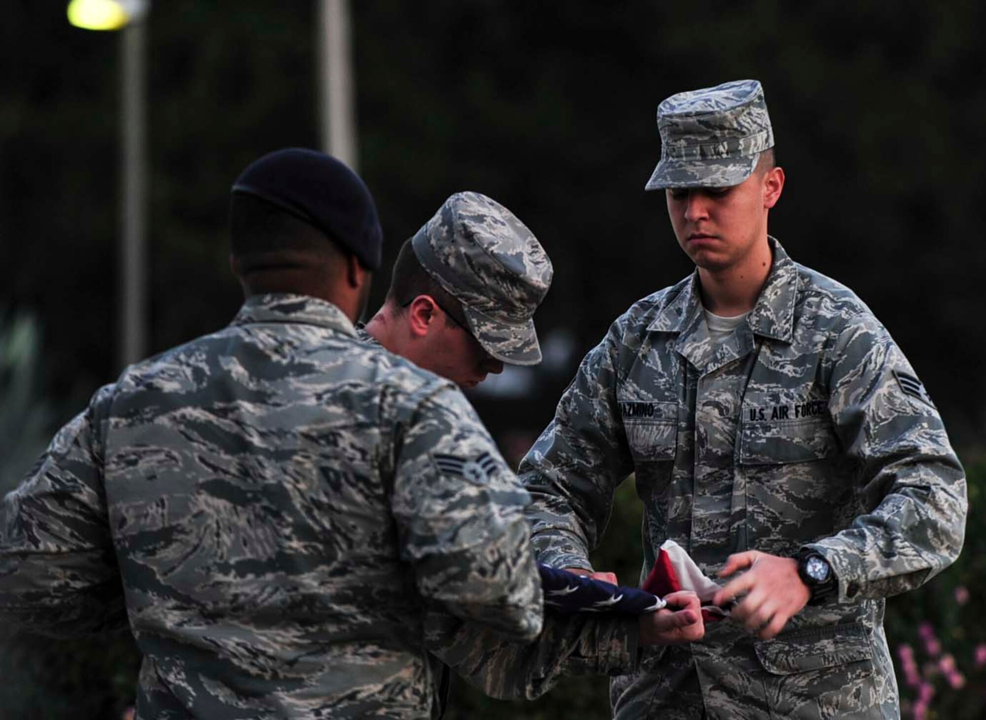 Airman Leadership School students fold an American flag during a Veterans Day retreat ceremony Nov. 10, 2014, Incirlik Air Base, Turkey. The ceremony included retreat and closing comments by the 39th Air Base Wing commander. (U.S. Air Force photo by Staff Sgt. Eboni Reams)