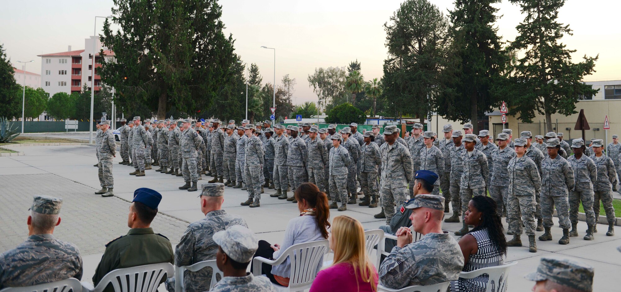 Several flights of Airmen formed up in front of the base flag pole for a Veterans Day retreat ceremony Nov. 10, 2014, Incirlik Air Base, Turkey. The ceremony included retreat and a flag folding ceremony. (U.S. Air Force photo by Staff Sgt. Eboni Reams)