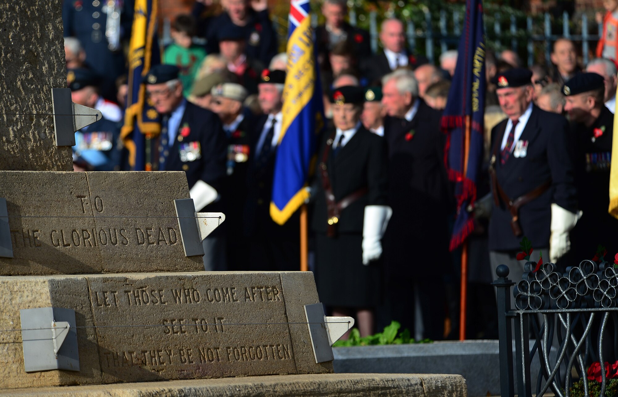 The War Memorial on Angel Hill was adorned with poppy wreaths during the Remembrance Day ceremony in Bury St. Edmunds, England, Nov. 9, 2014, in honor of those who paid the ultimate sacrifice. Airmen from RAFs Lakenheath and Mildenhall participated in the ceremony by laying poppy wreaths to show their support and reverence. (U.S. Air Force photo by Senior Airman Erin O’Shea/Released) 