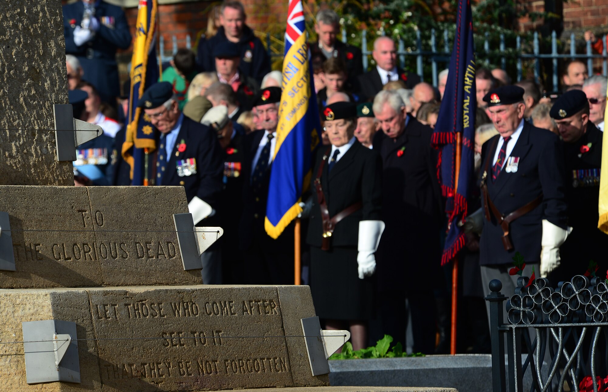 Col. Robert Novotny, 48th Fighter Wing commander, approaches the War Memorial on Angel Hill during the Remembrance Day ceremony in Bury St. Edmunds, England, Nov. 9, 2014. U.S. and British representatives laid poppy wreaths on the memorial to show their respect to fallen heroes. (U.S. Air Force photo by Senior Airman Erin O’Shea/Released) 