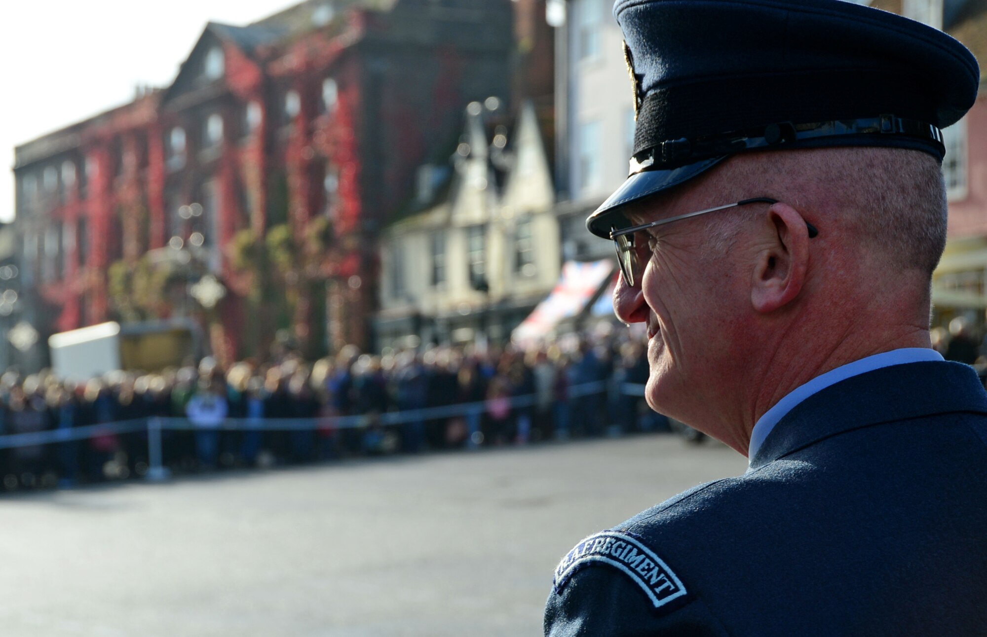 A British Royal Air Force Regiment military representative observes the Remembrance Day ceremony on Angel Hill in Bury St. Edmunds, England, Nov. 9, 2014. The ceremony was held to pay respect to heroes who made the ultimate sacrifice. (U.S. Air Force photo by Senior Airman Erin O’Shea/Released)