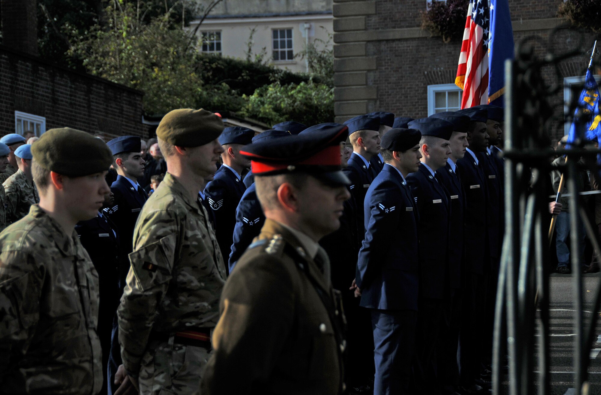 U.S. Air Force and British military representatives gather on Angel Hill in Bury St. Edmunds, England, Nov. 9, 2014, to pay respect to fallen heroes who have made the ultimate sacrifice. On Remembrance Day, Airmen from RAFs Lakenheath and Mildenhall participated in the ceremony by laying poppy wreaths to show their support and reverence. (U.S. Air Force photo by Senior Airman Erin O’Shea/Released) 