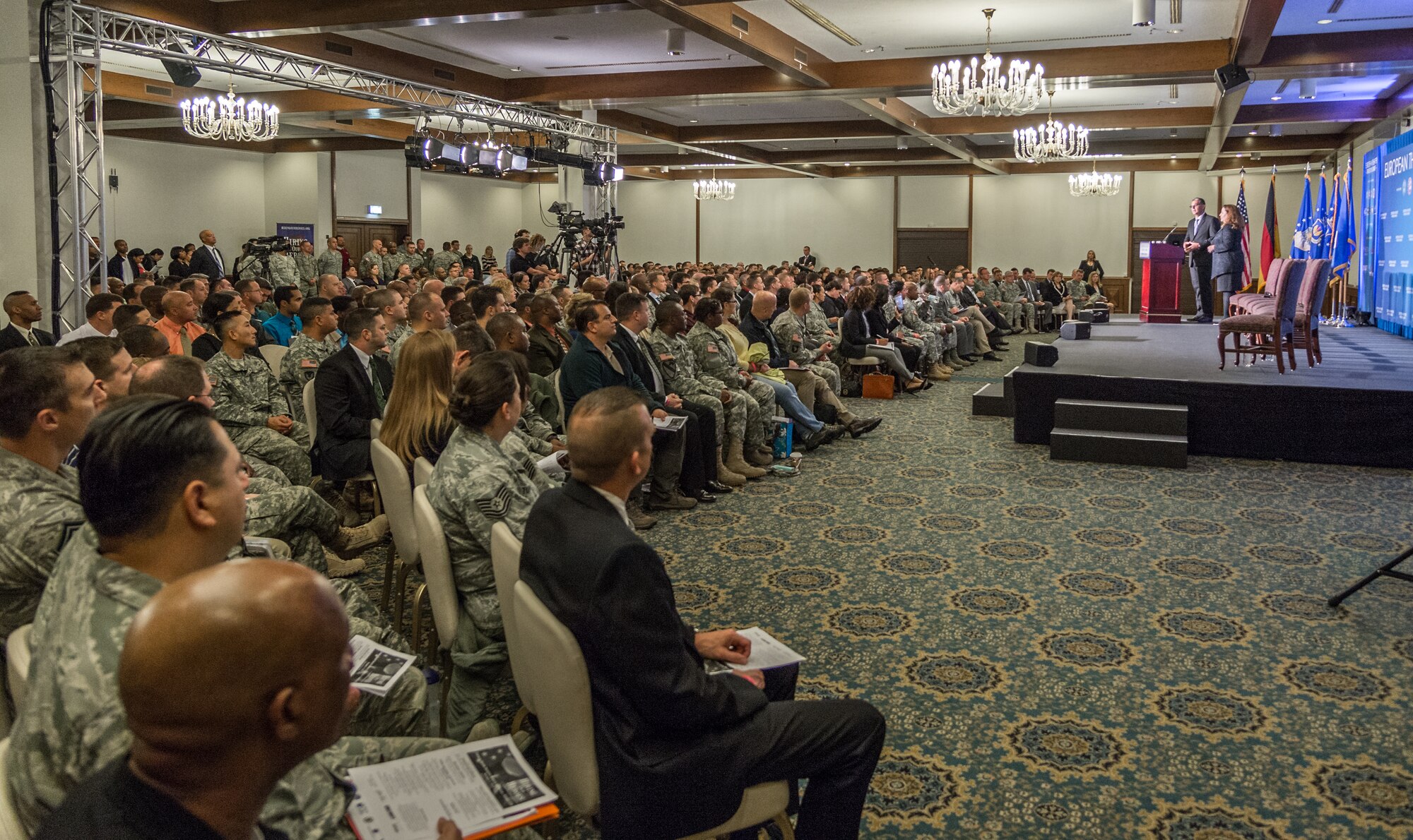 Service members and spouses listen to a seminar during the European Theater Job Fairs and Transition Summit Event sponsored by the U.S. Chamber of Commerce Foundation on Ramstein Air Base, Germany, Nov. 3, 2014. Since its introduction, more than 24,000 veterans and military spouses have obtained jobs through the Hiring our Heroes job fair program. (U.S. Air Force photo/Senior Airman Jordan Castelan)
