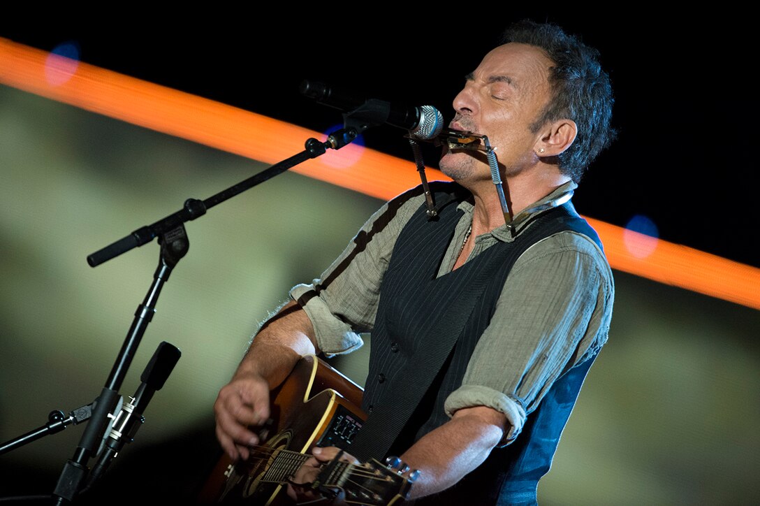 Bruce Springsteen plays harmonica and guitar during his performance at the Concert for Valor in Washington, D.C., Nov. 11, 2014. 