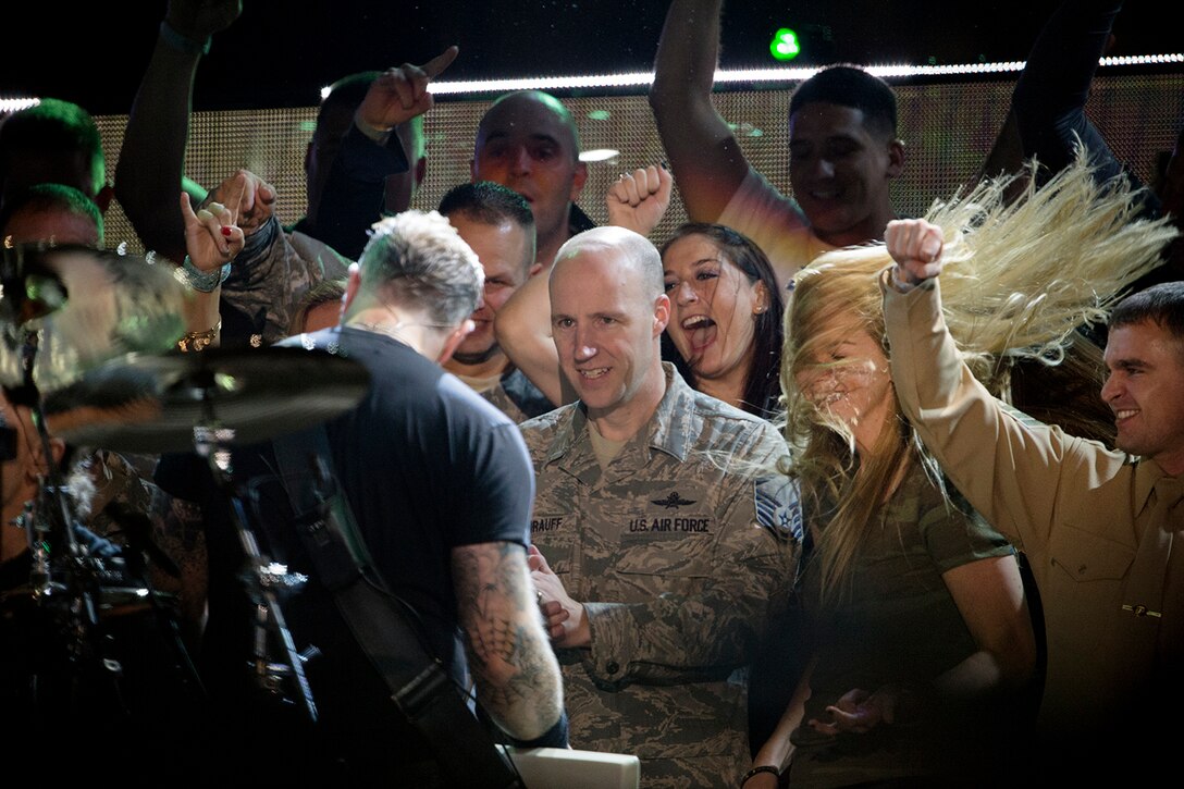 Service members enjoy an up-close performance by Metallica's James Hetfield on the stage during the Concert for Valor in Washington, D.C., Nov. 11, 2014. 