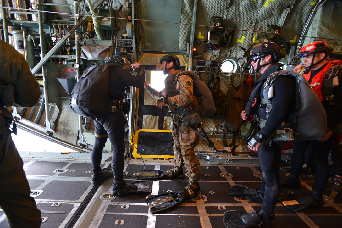 Air Force pararescuemen prepare to conduct training during the Southern Strike 15 exercise over the Gulf of Mexico, Nov. 5, 2014. Southern Strike’s objective is to provide tailored, cost-effective, realistic combat training for National Guard personnel in a joint and multinational environment. The pararescuemen are assigned to the New York National Guard's 103rd Rescue Squadron.