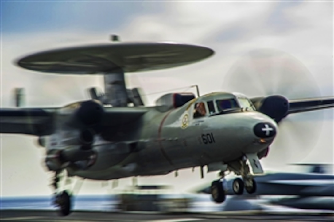 An E-2C Hawkeye makes an arrested landing on the flight deck of the USS George Washington during exercise Keen Sword 2015 at sea, Nov. 11, 2014. Keen Sword, a bilateral field training exercise involving members of the U.S. military and the Japan Self Defense Force, is designed to increase combat readiness and interoperability. 