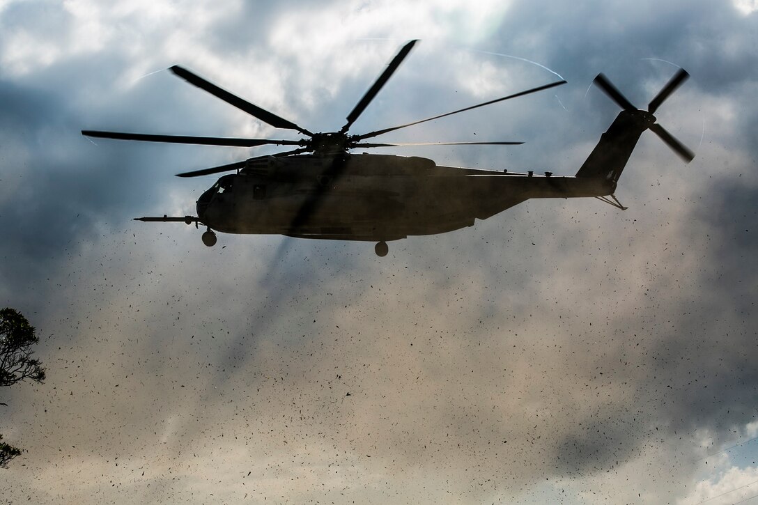 A CH-53E Super Stallion prepares to land Nov. 5 during a simulated tactical recovery of aircraft and personnel exercise as part of exercise Blue Chromite 15 at LZ Dodo in the Central Training Area. The landing zone was near combat town, the last known location of the downed aircraft crew members. Upon arriving in combat town, the Marines had to engage opposing forces and track the crew members’ location. The CH-53E is with HMH-XXX, Marine Aircraft Group 36, 1st Marine Aircraft Wing, III Marine Expeditionary Force