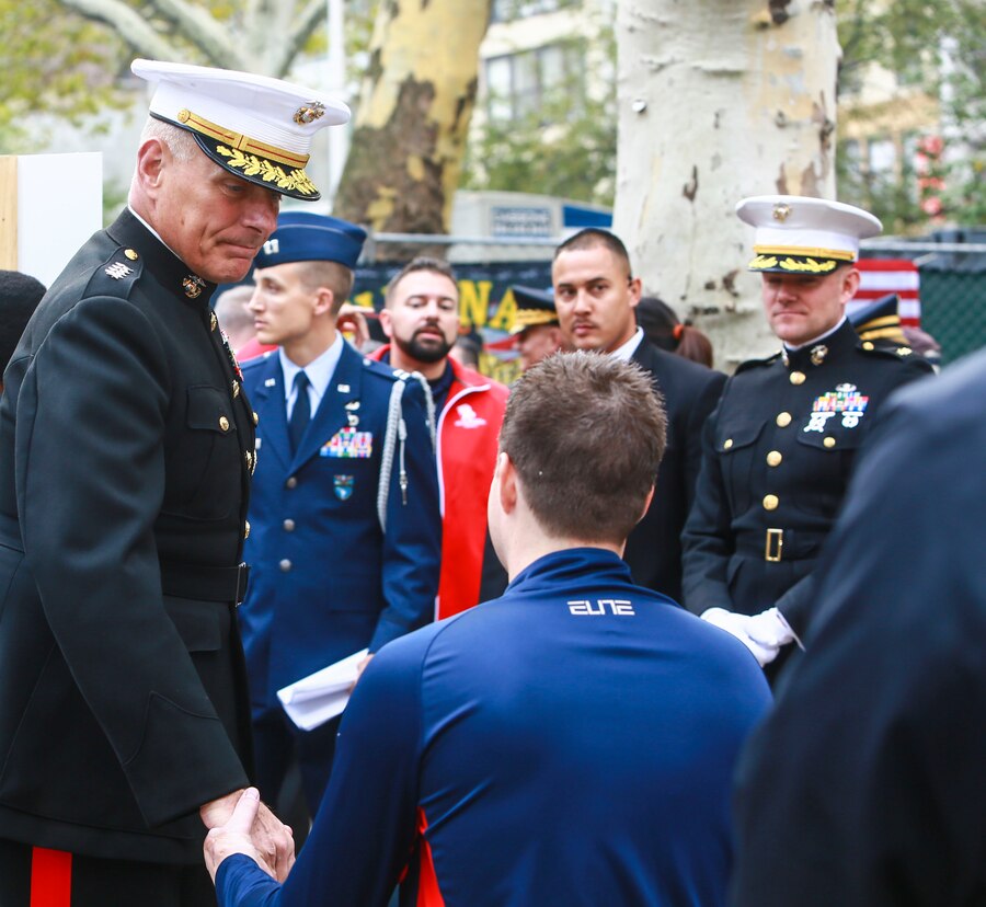 General John Kelly holds the hand of a wounded warrior during the New York City Veterans Day Opening Ceremony Nov. 11, 2014. In addition to the parades service members, more than 6,000 people were in attendance. (U.S. Marine Corps photo by Cpl. Elizabeth Thurston/Released)