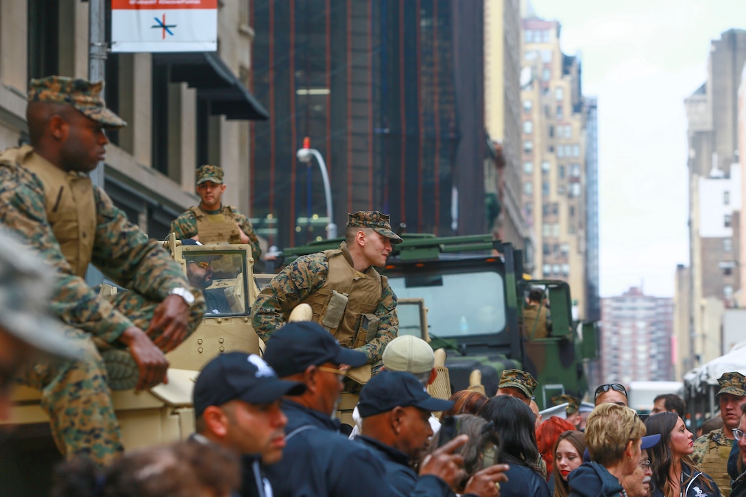 Marines of 2nd Battalion 25th Marines, conduct a static display with military vehicles allowing civilians to see them prior to the start of the 95th Annual New York City Veterans Day Parade in Manhattan, N.Y., Nov. 11, 2014. In addition to the parades service members, more than 6,000 people were in attendance. (U.S. Marine Corps photo by Cpl. Elizabeth Thurston/Released)