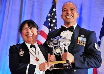 Col. Mary Salcido, director of Air National Guard Recruiting and Retention,
awards Tech. Sgt. Gurston Hoebing from the Guam Air National Guard with the Director's Award for Recruiting and Retention during a formal awards banquet in Dallas Feb. 22, 2010. "He never stops smiling," said Salcido, who called Hoebing's accomplishments "amazing." The Air Guard's 600-plus recruiters applauded their many accomplishments during their annual recruiting and retention workshop Feb. 22-26, 2010. (U.S. Air Force photo by Master Sgt. Mike R. Smith, National Guard Bureau) (Released)