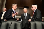 Army Secretary John McHugh talks with Sen. John McCain and Sen. Joseph Lieberman before the Senate Armed Services Committee hearing on the Army's 2011 fiscal year budget in Washington, D.C., Feb. 23, 2010.
