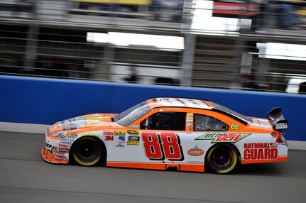 Dale Earnhardt Jr., (left) drives the No. 88 National Guard-sponsored NASCAR race car Feb. 21 at Fontana Speedway, Calif.