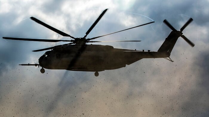 A CH-53E Super Stallion prepares to land Nov. 5 during a simulated tactical recovery of aircraft and personnel exercise as part of exercise Blue Chromite 15 at LZ Dodo in the Central Training Area. The landing zone was near combat town, the last known location of the downed aircraft crew members. Upon arriving in combat town, the Marines had to engage opposing forces and track the crew members’ location. The CH-53E is with HMH-XXX, Marine Aircraft Group 36, 1st Marine Aircraft Wing, III Marine Expeditionary Force.