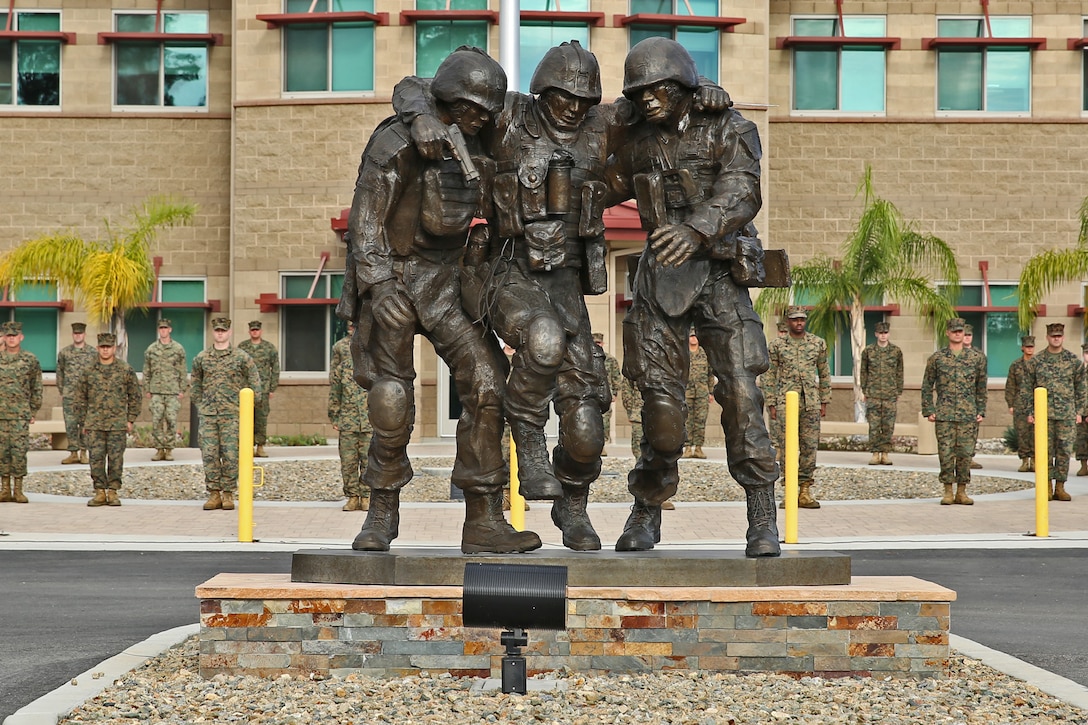 The Wounded Warrior Battalion-West held a ceremony Nov. 12 to unveil a monument honoring servicemembers wounded during combat. The sculpture is based on the Operation Phantom Fury photograph 'Hell House' of then 1st Sgt. Bradley Kasal being carried out of a house by two lance corporals after a firefight where Kasal sustained injuries. "The monument is a symbol of camaraderie that's important to Marines, not only in combat but in the healing process as well, " said Robin Kelleher, president of Hope for the Warriors, which  contributed to constructing the monument.