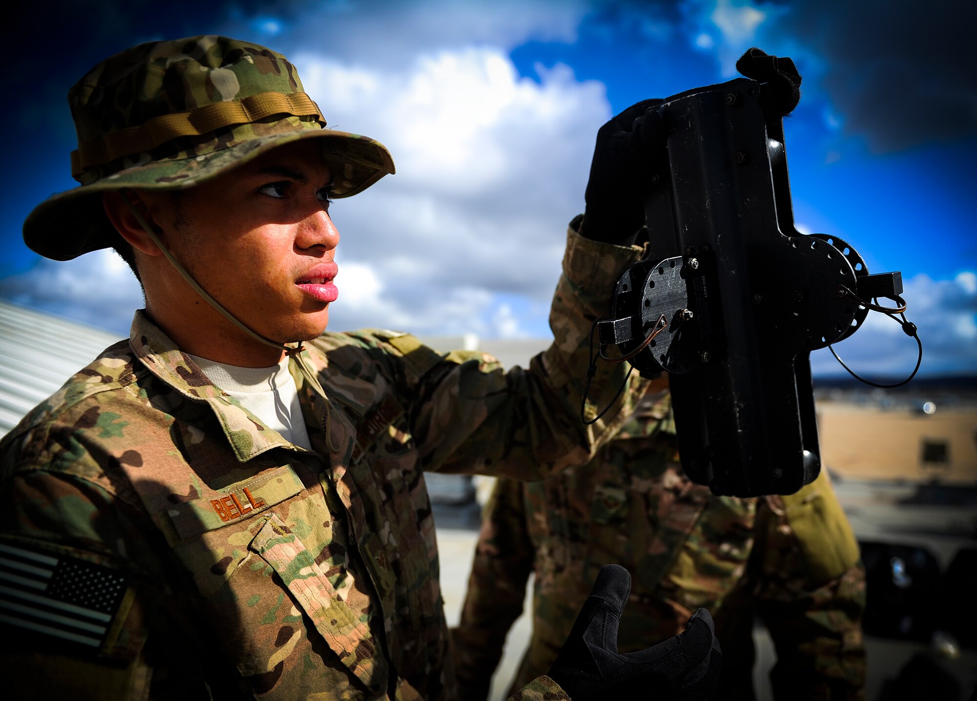 Senior Airman Jevon Bell, 1st Special Operations Communications Squadron tactical communication technician, constructs an antenna in preparation for Exercise Carbonite Archer on Marine Corps Air Station Miramar at San Diego, Calif., Nov. 1, 2014. Carbonite Archer is an emergency deployment readiness exercise focusing on the 1st Special Operations Wing’s ability to deploy aircraft and personnel anytime and anywhere in the world. (U.S. Air Force photo/Senior Airman Christopher Callaway)