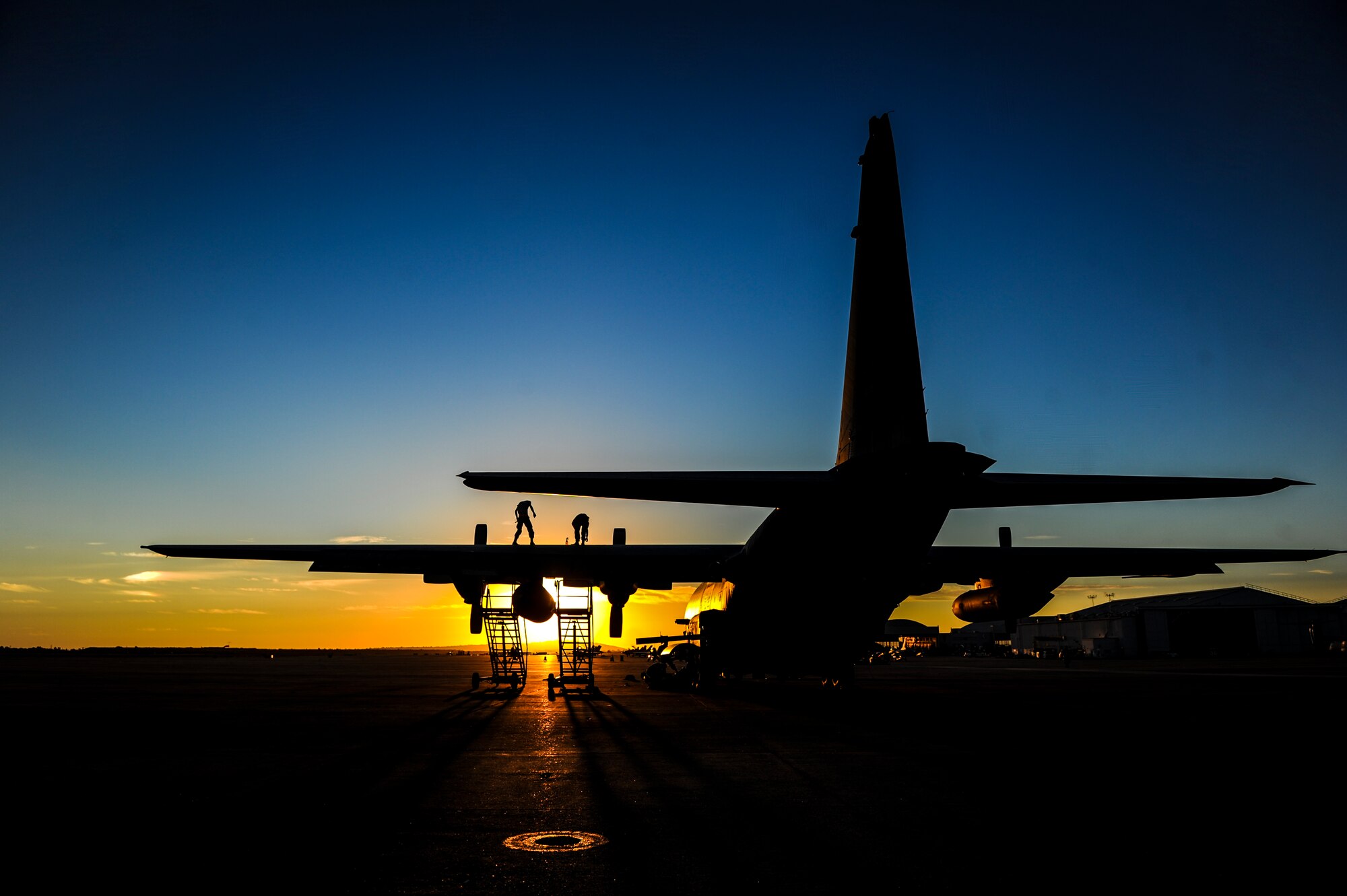 Members from the 1st Special Operations Aircraft Maintenance Squadron work on the wing of an AC-130U Spooky Gunship, during Exercise Carbonite Archer, Marine Corp Air Station Miramar, Calif., Nov. 3, 2014. Carbonite Archer is an emergency deployment readiness exercise focusing on the 1st Special Operations Wing’s ability to deploy aircraft and personnel anytime and anywhere in the world. (U.S. Air Force photo/Senior Airman Christopher Callaway)