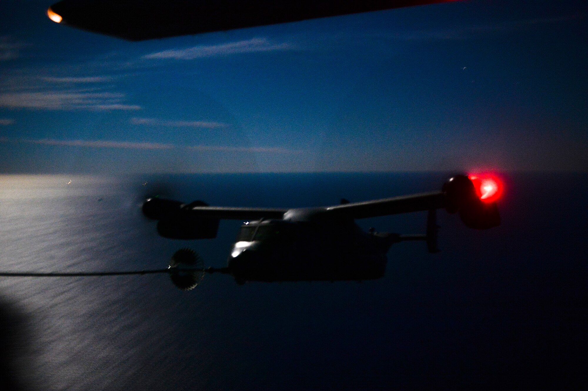 A CV-22 Osprey prepares to refuel from an MC-130H Talon II, during Exercise Carbonite Archer, Nov. 5, 2014. Carbonite Archer is an emergency deployment readiness exercise focusing on the 1st Special Operations Wing’s ability to deploy aircraft and personnel anytime and anywhere in the world. (U.S. Air Force photo/Senior Airman Christopher Callaway)