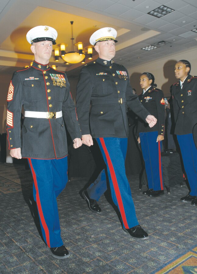 Maj. Gregory M. Long, (right) officer-in-charge, Detachment 2, Supply Company, Combat Logistics Battalion-453, escorts guest of honor Sgt. Maj. James J. Karnes Jr., regimental sergeant major, Combat Logistics Regiment-4, 4th Marine Logistics Group, during the detachment’s 239th Marine Corps Birthday Ball celebration at the Hilton Garden Inn in Albany, Ga., Nov. 1.