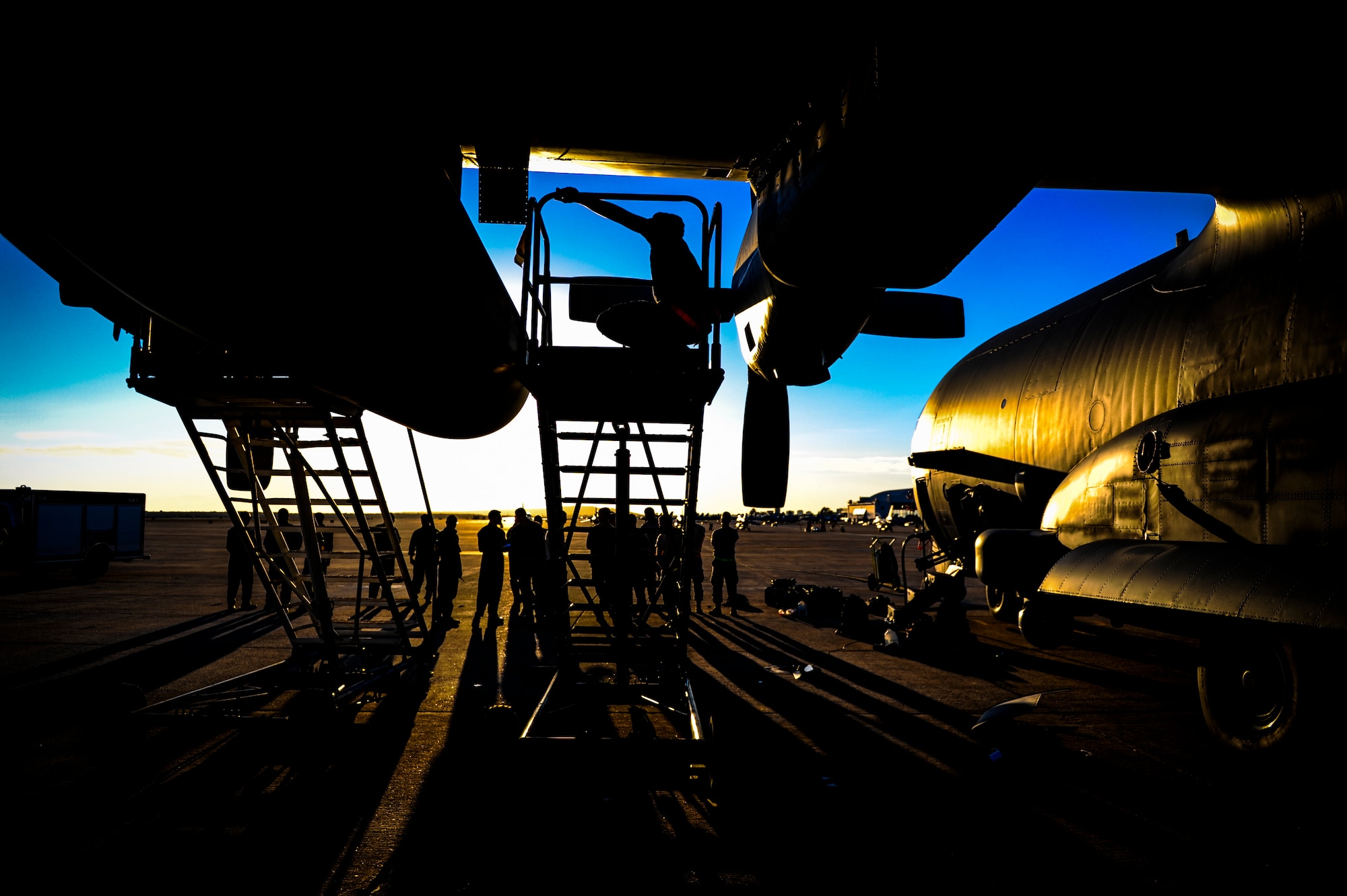 Members from the 1st Special Operations Aircraft Maintenance Squadron work on the wing of an AC-130U Spooky Gunship, during Exercise Carbonite Archer, Marine Corp Air Station Miramar, Calif., Nov. 3, 2014. Carbonite Archer is an emergency deployment readiness exercise focusing on the 1st Special Operations Wing’s ability to deploy aircraft and personnel anytime and anywhere in the world. (U.S. Air Force photo/Senior Airman Christopher Callaway)
