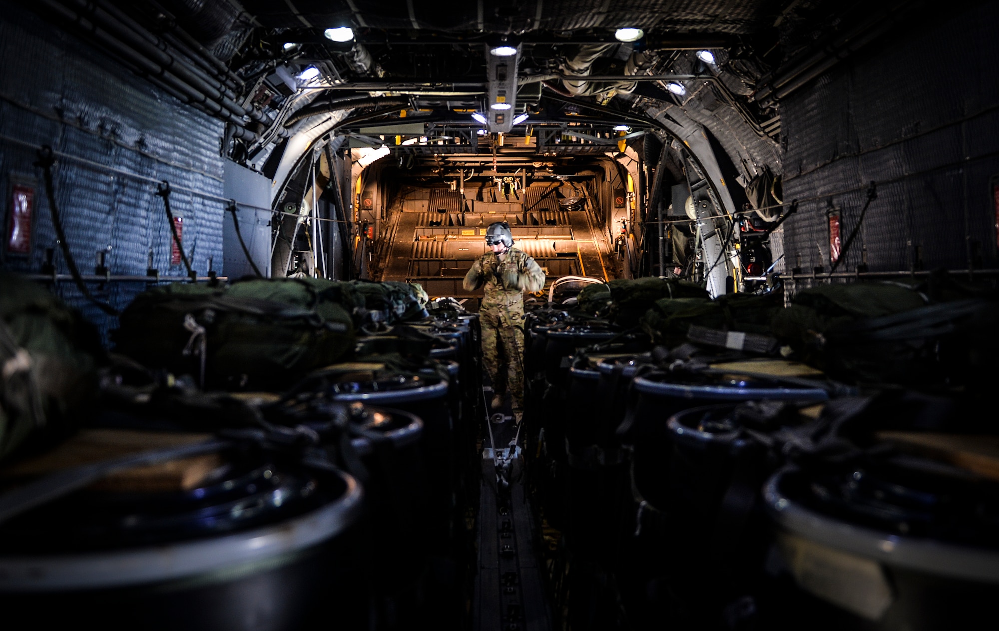 Staff Sgt. Sean Krumwiede, 15th Special Operations Squadron loadmaster, prepares bundles for an air drop over San Clemente, Calif., during Exercise Carbonite Archer, Nov. 5, 2014. Carbonite Archer is an emergency deployment readiness exercise focusing on the 1st Special Operations Wing’s ability to deploy aircraft and personnel anytime and anywhere in the world. (U.S. Air Force photo/Senior Airman Christopher Callaway)