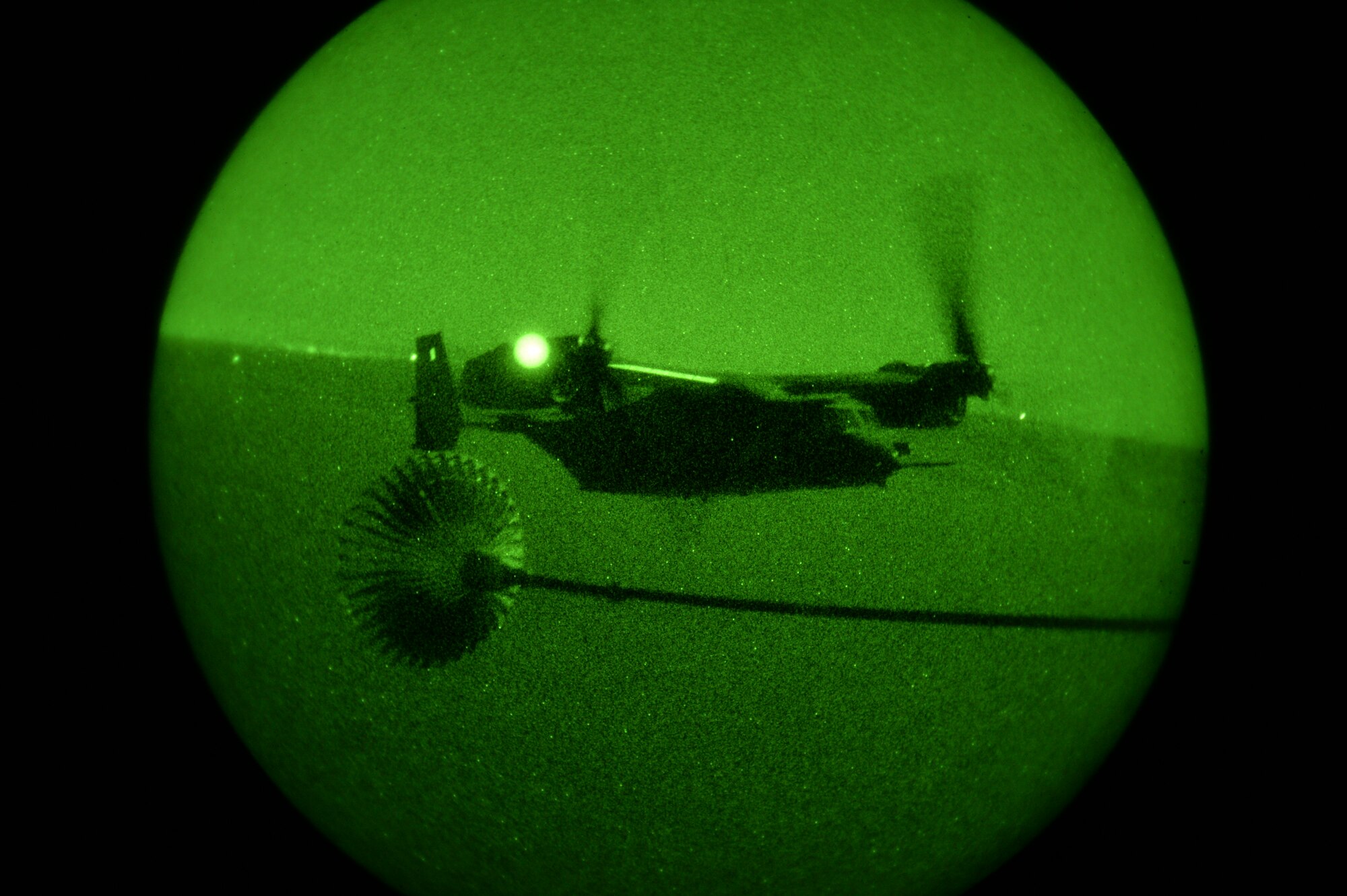 A CV-22 Osprey prepares to refuel from an MC-130H Talon II, during Exercise Carbonite Archer, Nov. 5, 2014. Carbonite Archer is an emergency deployment readiness exercise focusing on the 1st Special Operations Wing’s ability to deploy aircraft and personnel anytime and anywhere in the world. (U.S. Air Force photo/Senior Airman Christopher Callaway)