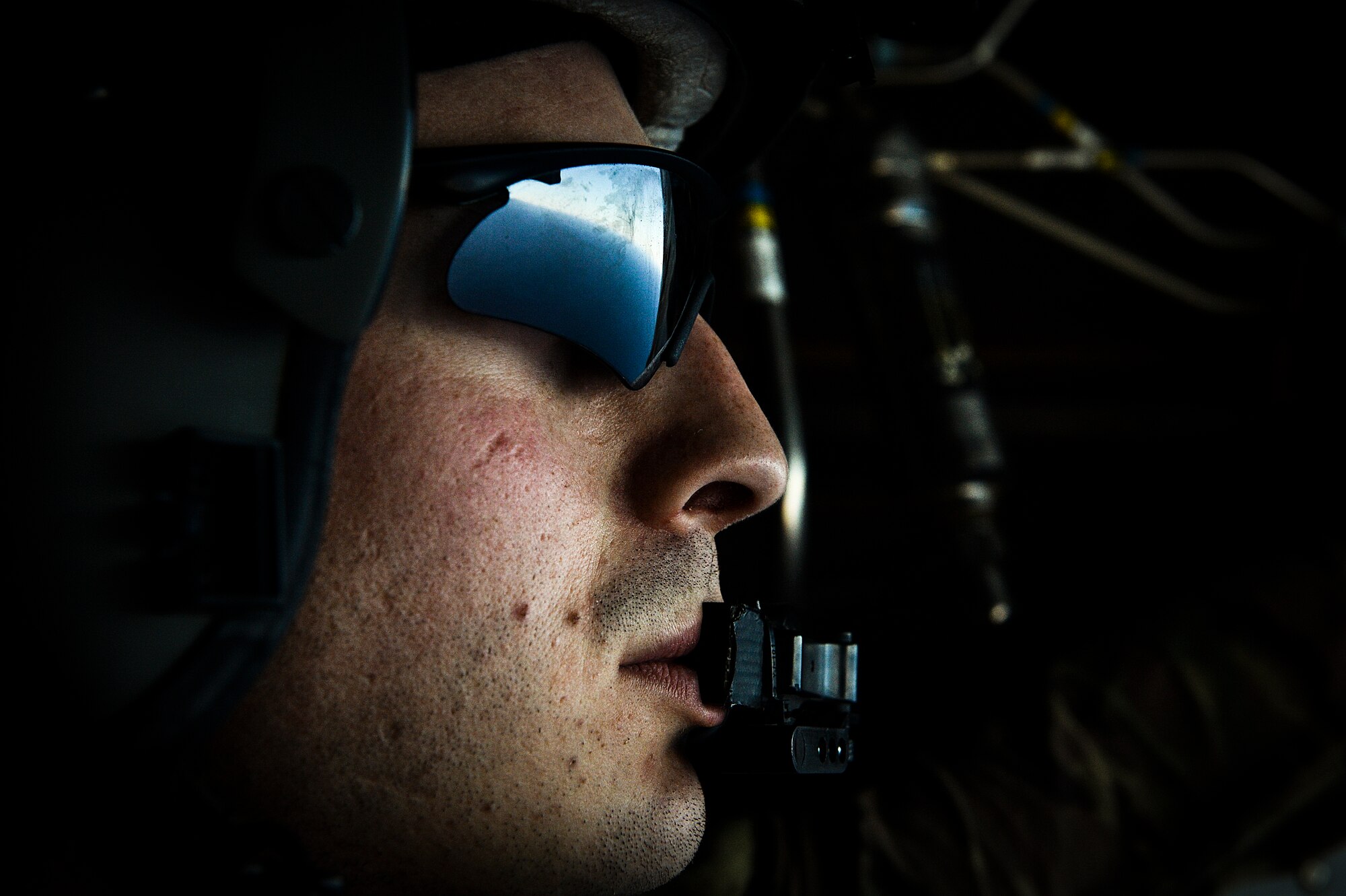 Senior Airman Stephen Hall, 8th Special Operations Squadron flight engineer, looks out the back ramp of a CV-22 Osprey during Exercise Carbonite Archer, Nov. 6, 2014. Carbonite Archer is an emergency deployment readiness exercise focusing on the 1st Special Operations Wing’s ability to deploy aircraft and personnel anytime and anywhere in the world. (U.S. Air Force photo/Senior Airman Christopher Callaway)