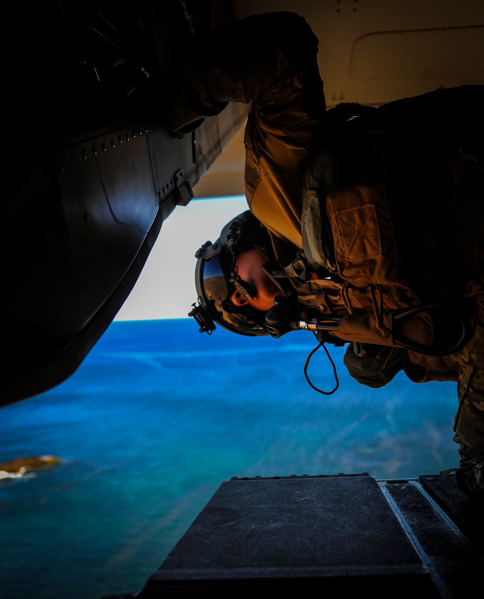 Senior Airman Stephen Hall, 8th Special Operations Squadron flight engineer, scans for obstacles to ensure his CV-22 Osprey lands safely during Exercise Carbonite Archer, San Diego, Calif., Nov. 6, 2014. Carbonite Archer is an emergency deployment readiness exercise focusing on the 1st Special Operations Wing’s ability to deploy aircraft and personnel anytime and anywhere in the world. (U.S. Air Force photo/Senior Airman Christopher Callaway)