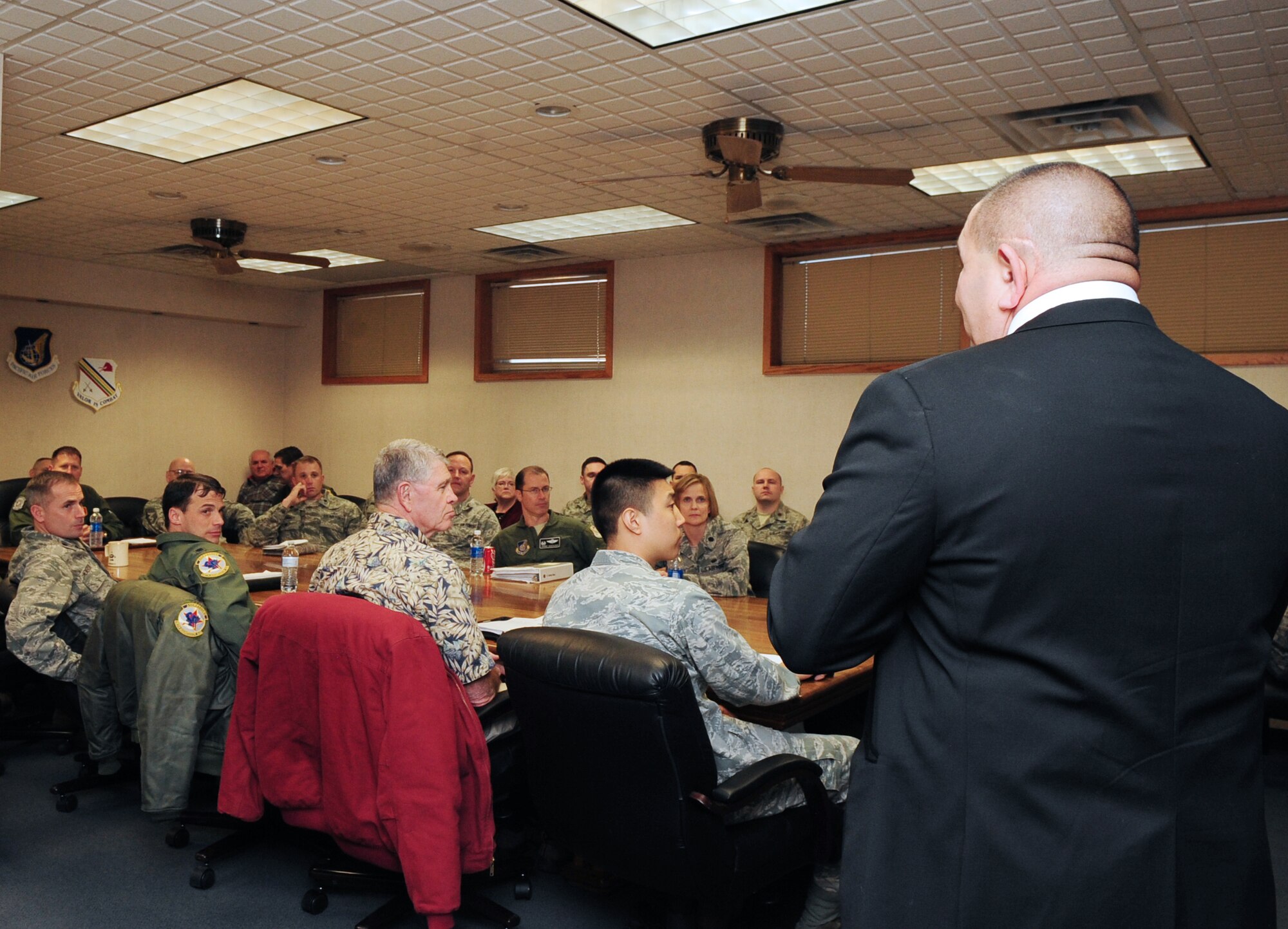 Johnny Hernandez, an Air Force recovery care coordinator, addresses Eielson's leadership on the services provided by the Air Force Recovery Care Office. Hernandez provides assistance to injured Airmen across Alaska. (U.S. Air Force photo by Senior Airman Lauren-Taylor Levin/Released)