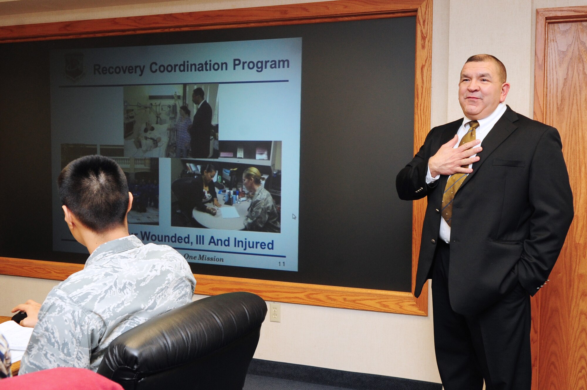Johnny Hernandez, an Air Force recovery care coordinator, addresses Eielson's leadership on the services provided by the Air Force Recovery Care Office. Hernandez provides assistance to injured Airmen across Alaska. (U.S. Air Force photo by Senior Airman Lauren-Taylor Levin/Released)